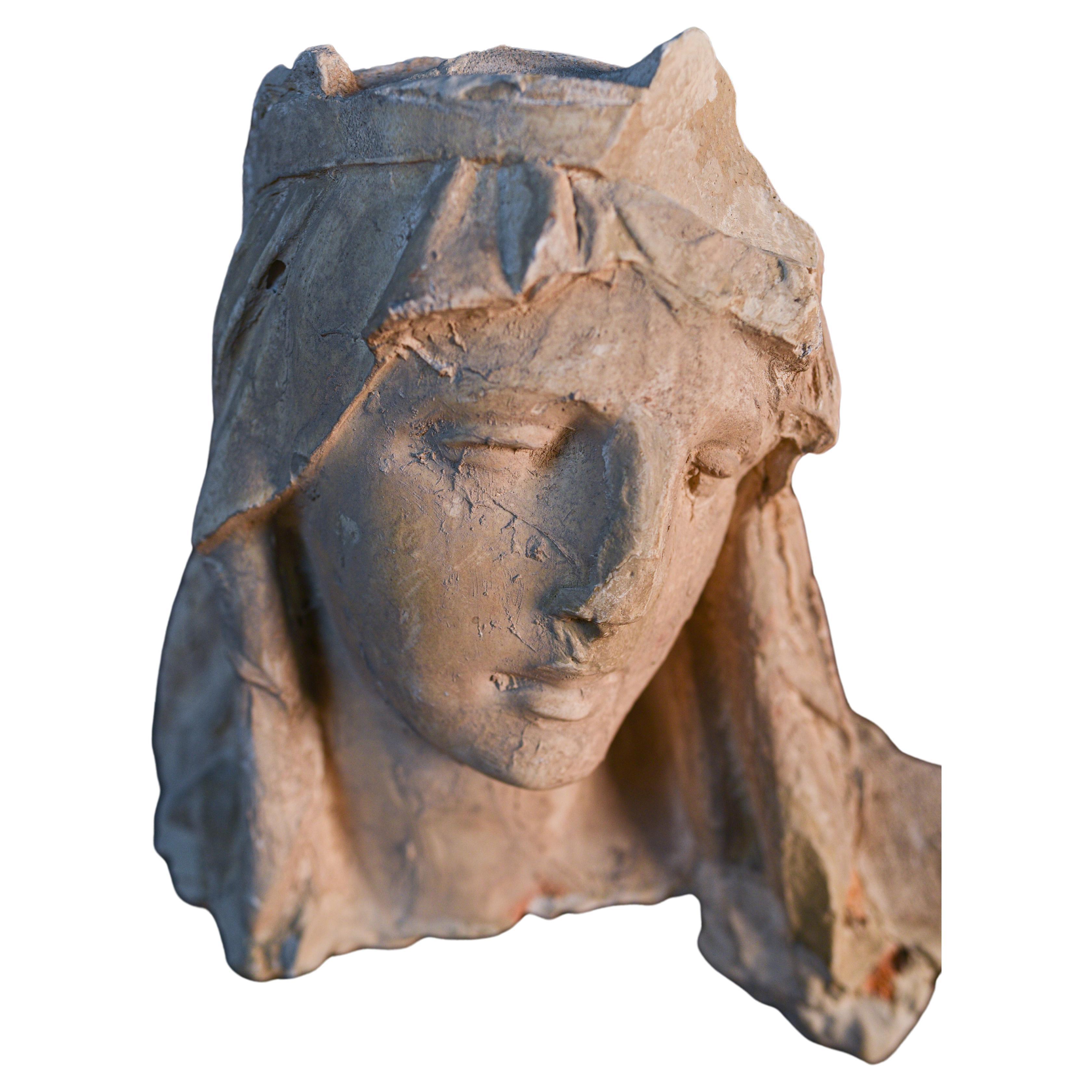 Neoclassical sculpture of Mother Mary's head, made from plaster and straw 