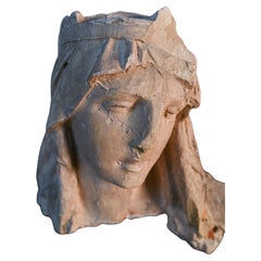 Neoclassical sculpture of Mother Mary's head, made from plaster and straw
