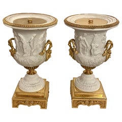 Paire d'urnes ou de vases néoclassiques de Sèvres en parian et bronze doré 1920s