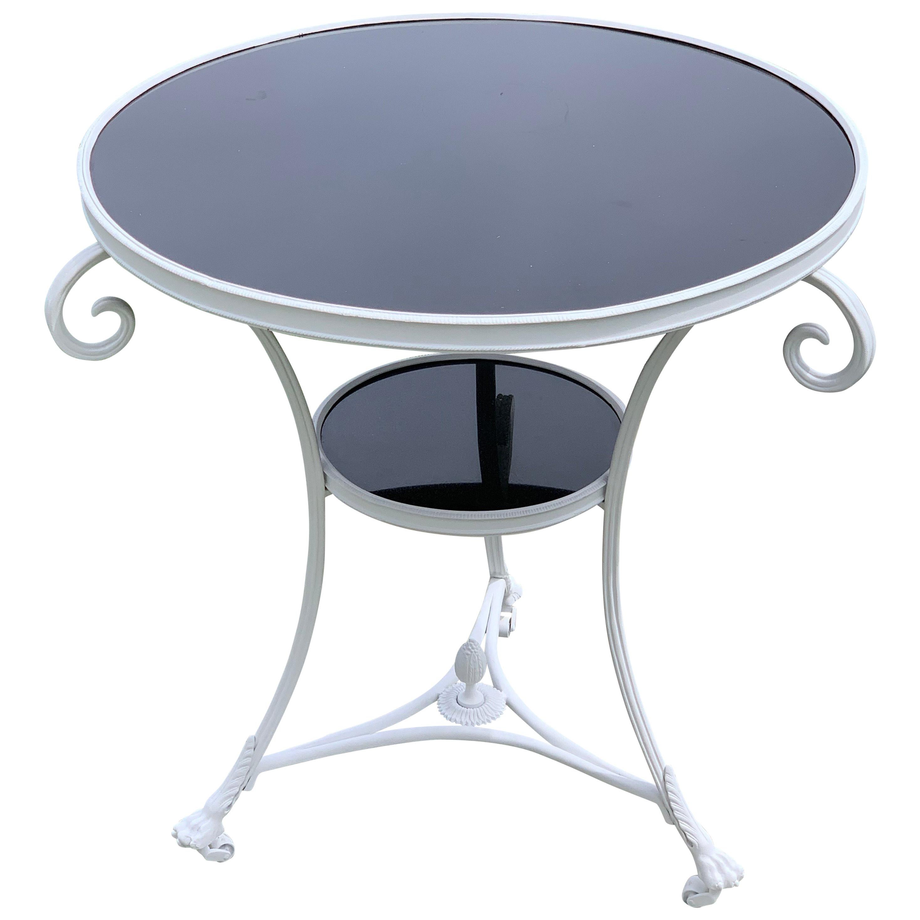 A Modern Black Marble Top Gueridon With a White Base 