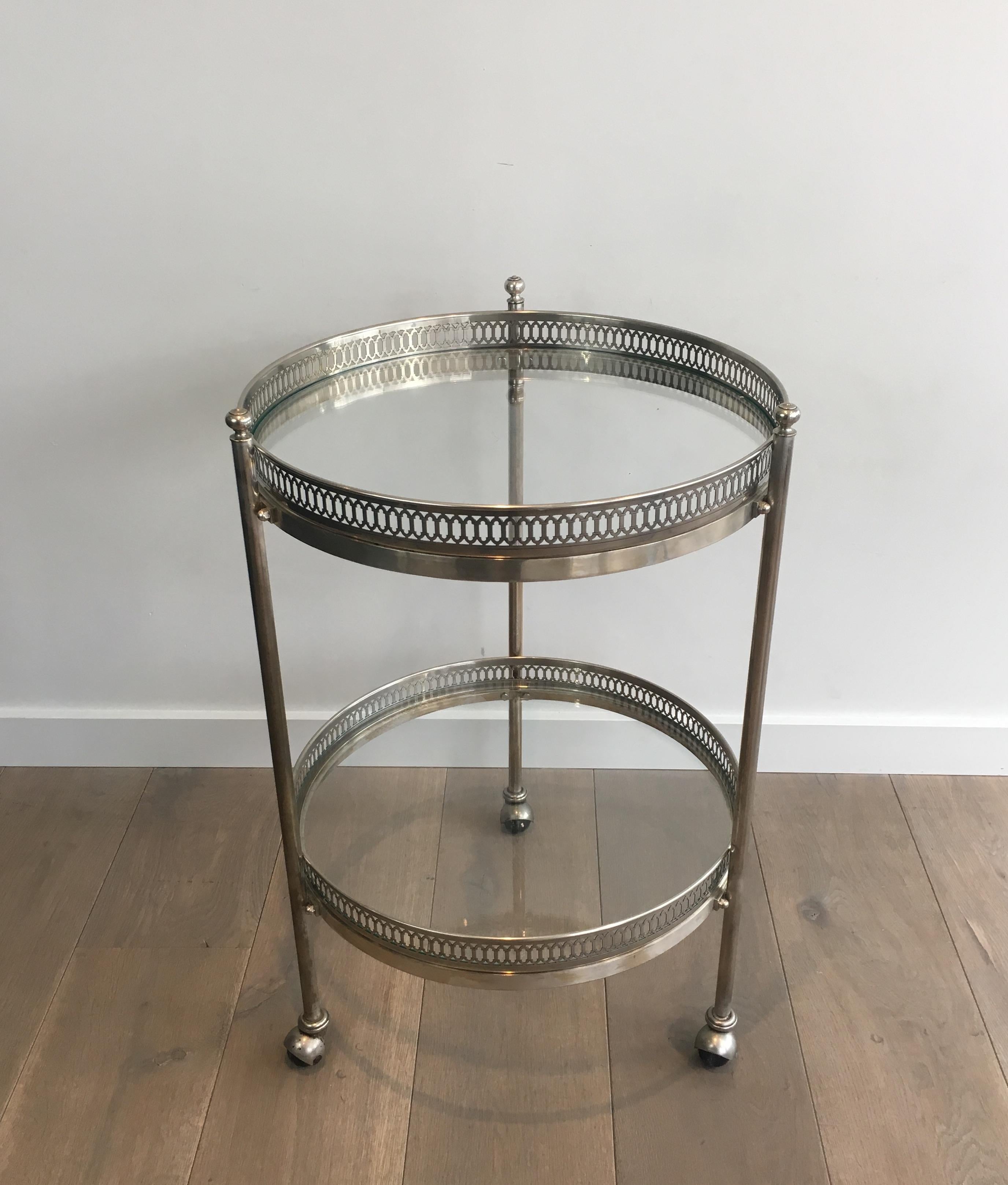 This unusual neoclassical large round trolley is made of silver plated brass. This is a French work, in the style of Maison Jansen, circa 1940.