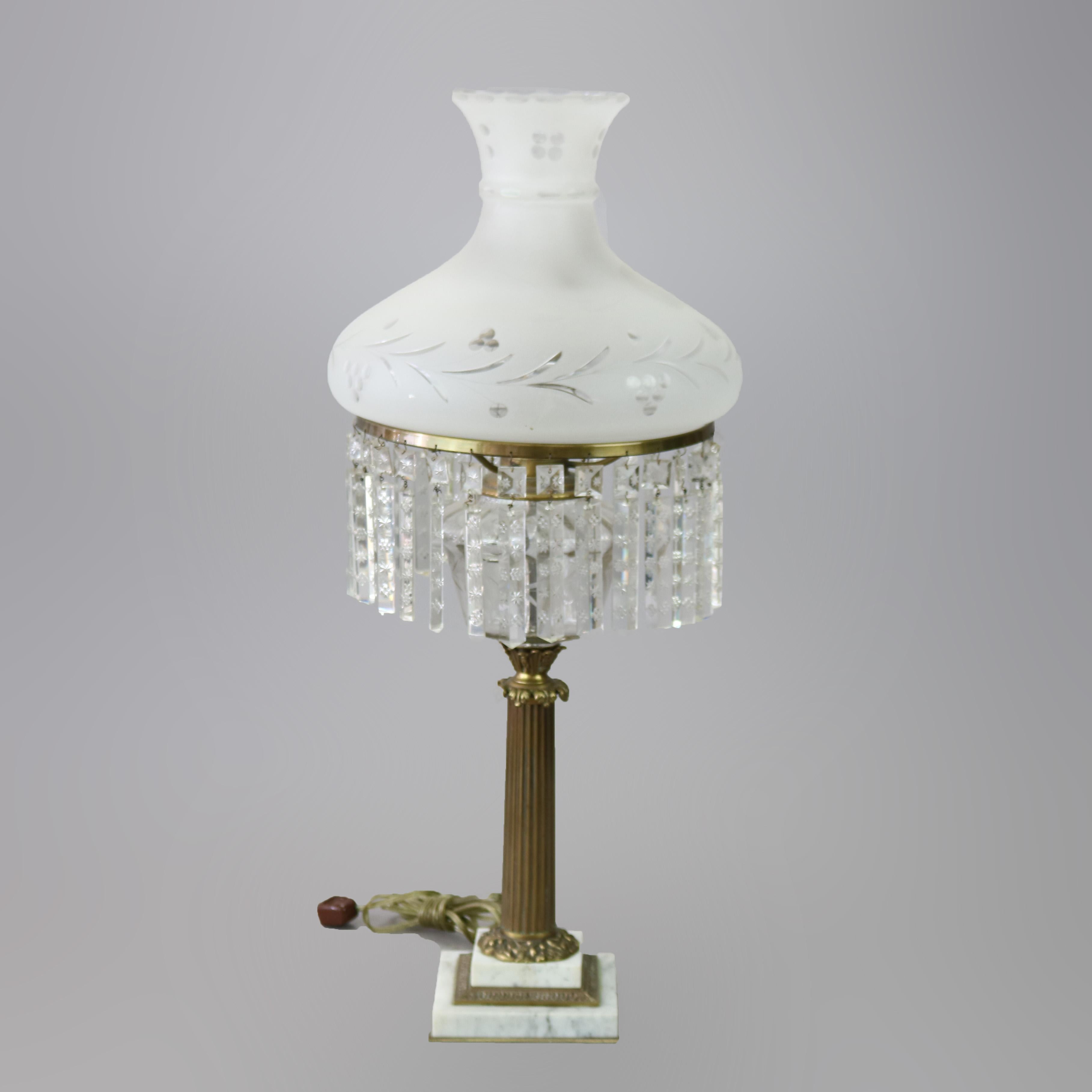An neoclassical Sinumbra style electric table lamp offers etched glass shade over double socket base having reeded Corinthian column pedestal having marble plinth, 20th century

Measures - 30.5'' H x 34.25'' W x 25.5'' D.
