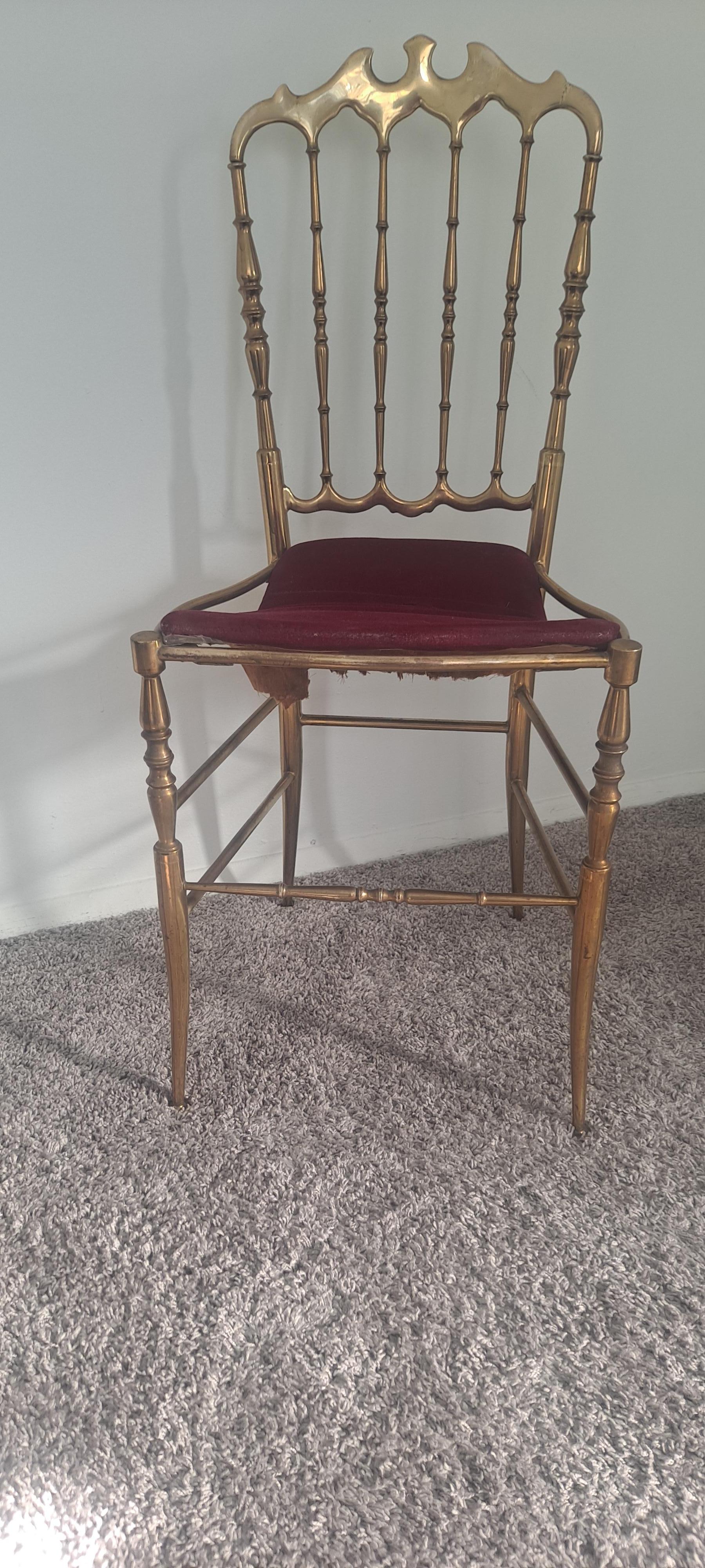 Italian brass chair in neoclassical style from the 1950 s. The chair seat is vine color . We have one more chair slightly different size.
