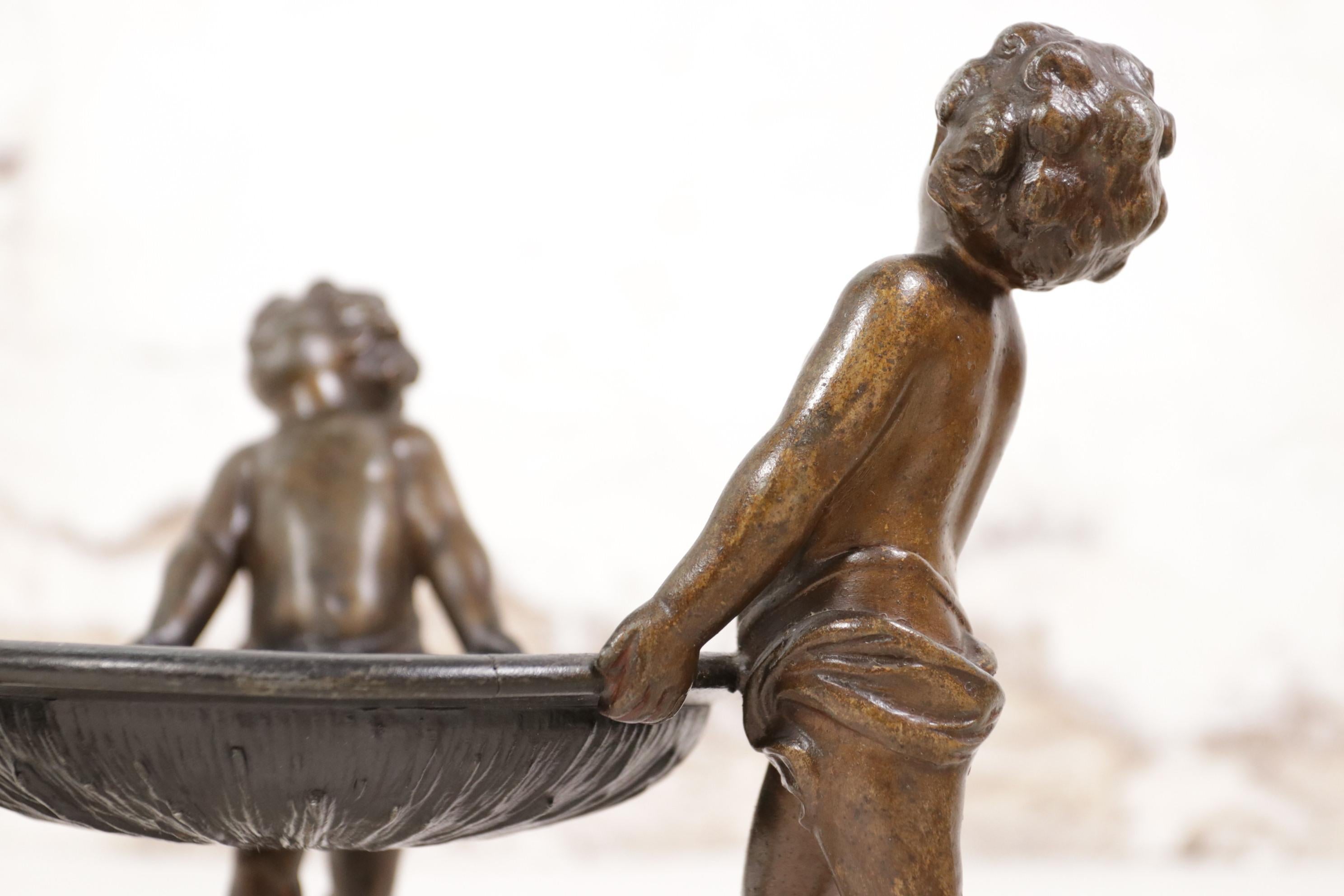 Neoclassical Spelter Bowl Carried by Three Little Angels In Good Condition In Boven Leeuwen, NL