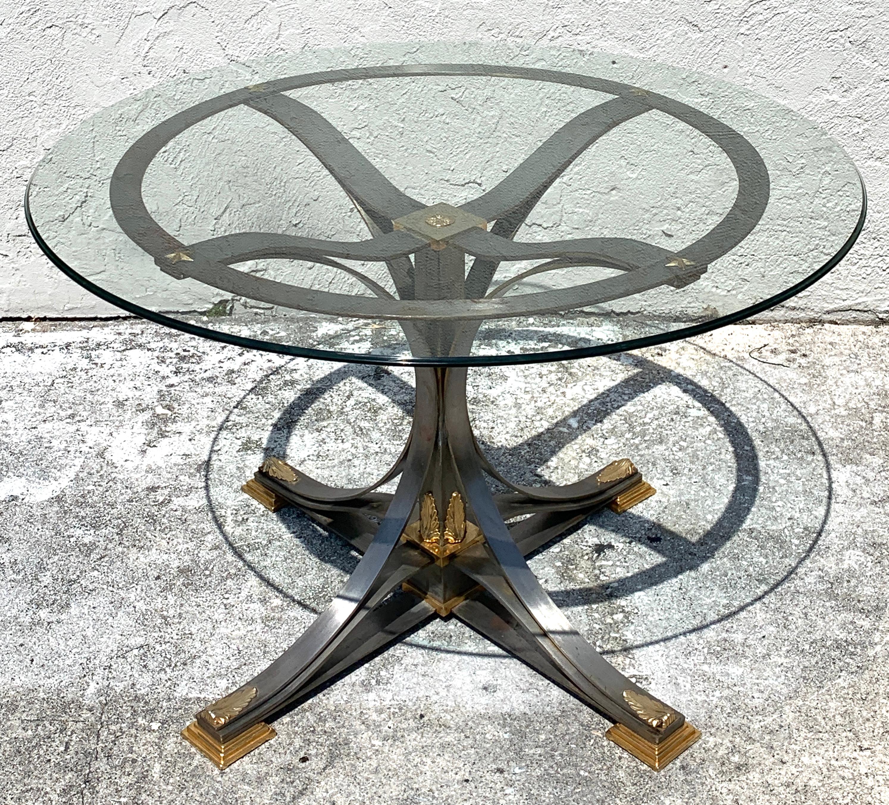 Neoclassical steel and gilt bronze table in the style of Maison Jansen
Base alone measures 34