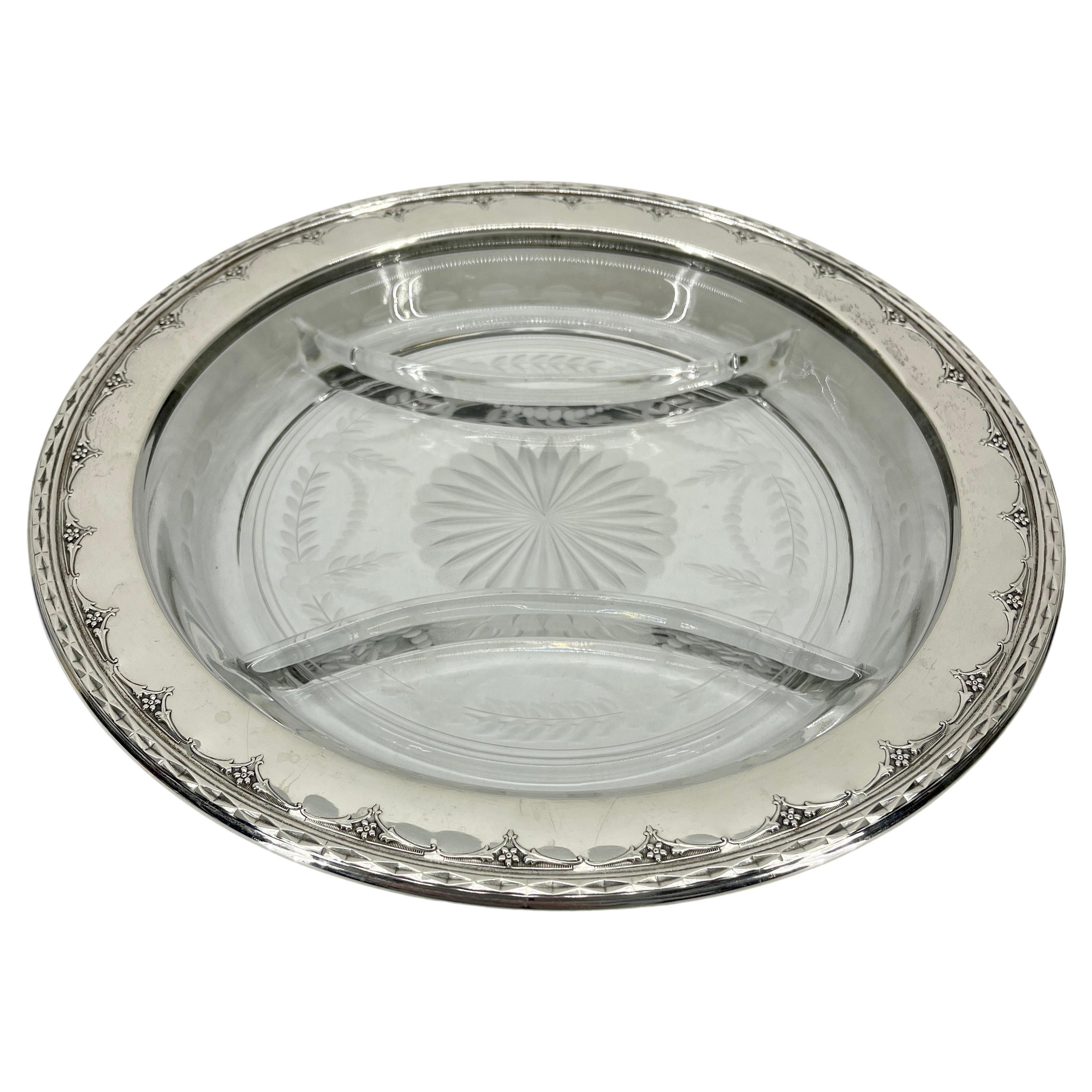 Antique Neoclassical Sterling Silver and Cut Glass Crudité and Condiments Dish.
This round and charming silver edged cut glass tray was made by Wallace Silversmiths in the early part of the 1900 hundreds. The sterling silver is marked and numbered