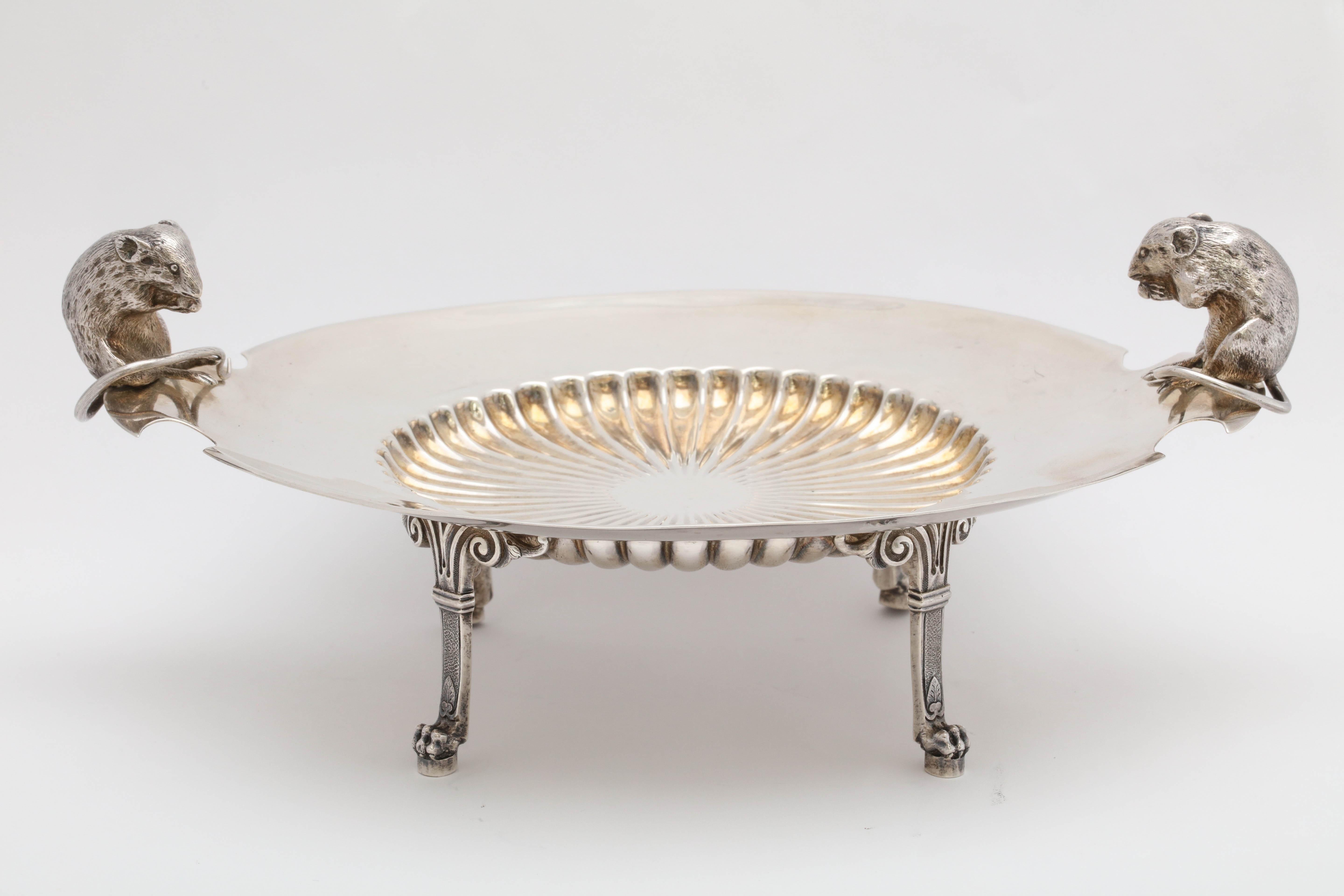Unusual, sterling silver, neoclassical, footed cheese dish, Gorham Manufacturing Co., Providence, Rhode Island, year hallmarked for 1876. Center of dish is lightly gilded and fluted. Each handle is in the form of a mouse eating cheese, overlooking