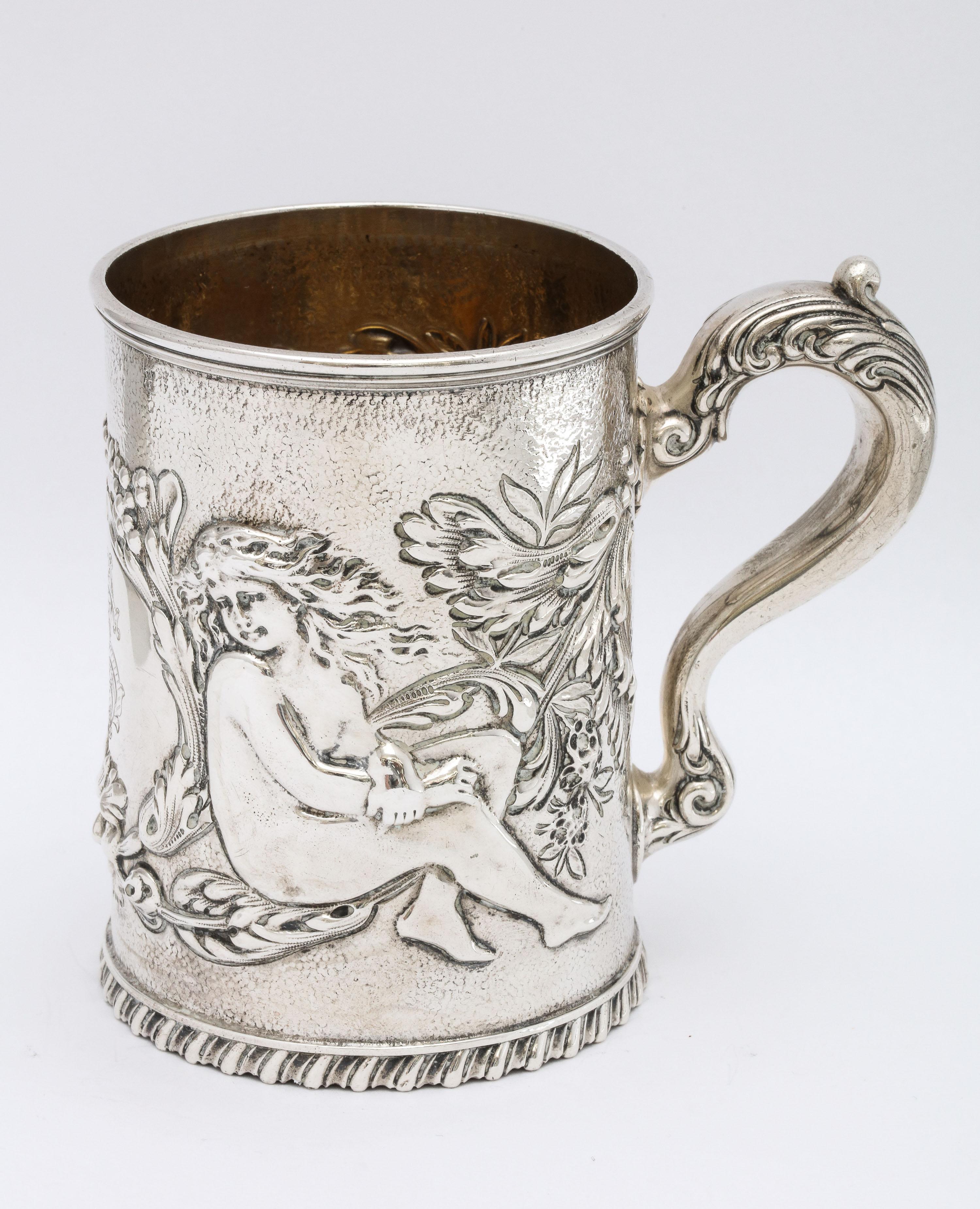 Neoclassical, sterling silver mug/cup, Providence, Rhode Island, Ca. 1880's, Whiting Mfg. Co. - maker. Measures almost 4 inches high x 4 1/2 inches wide from edge of handle to outer edge of rim of cup x 3 inches diameter of opening. Gilded interior.