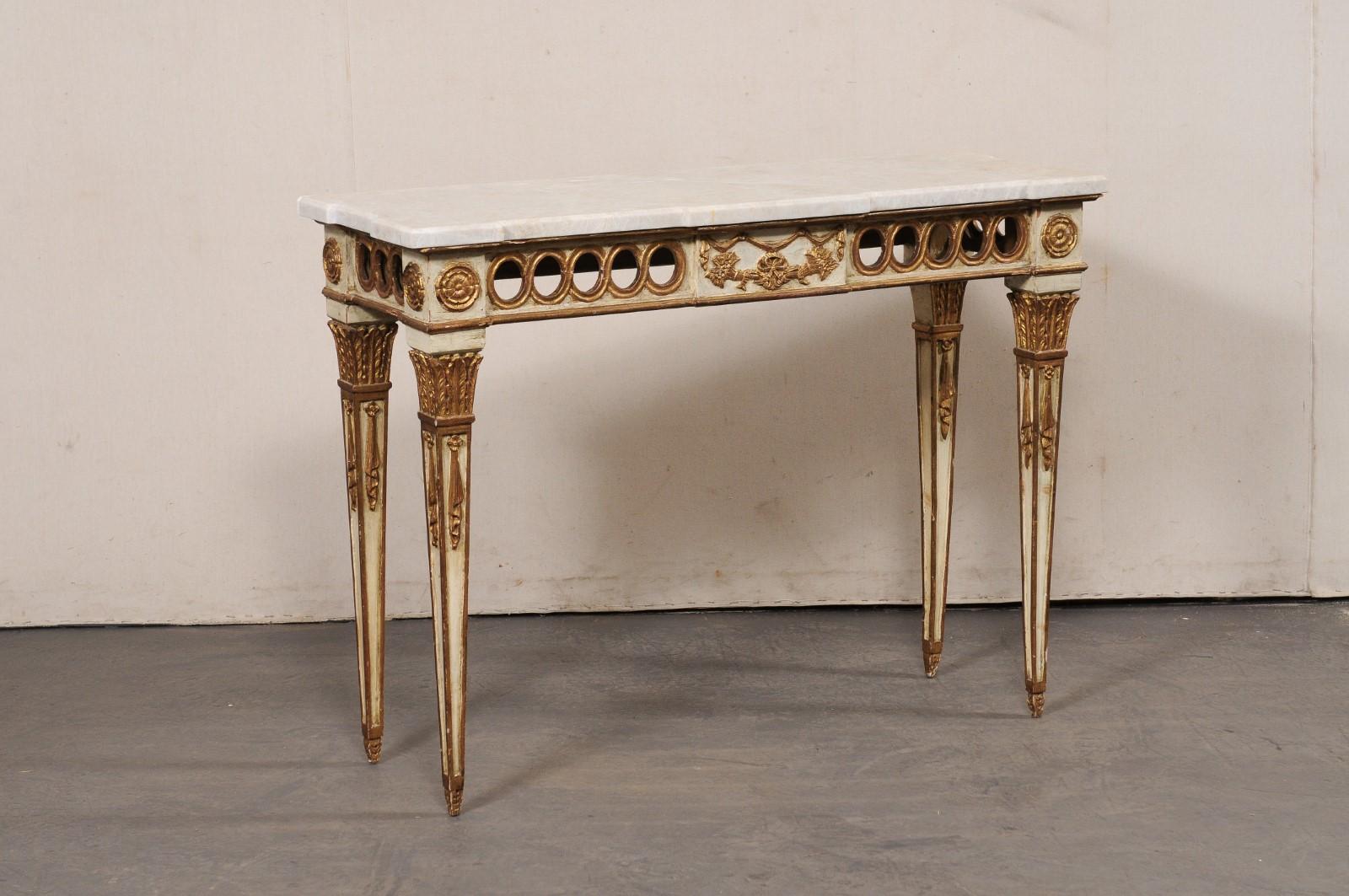 An Italian Neoclassic style carved-wood console, with original finish and a new quartzite top, from the mid 20th century. This vintage table from Italy has a new custom 