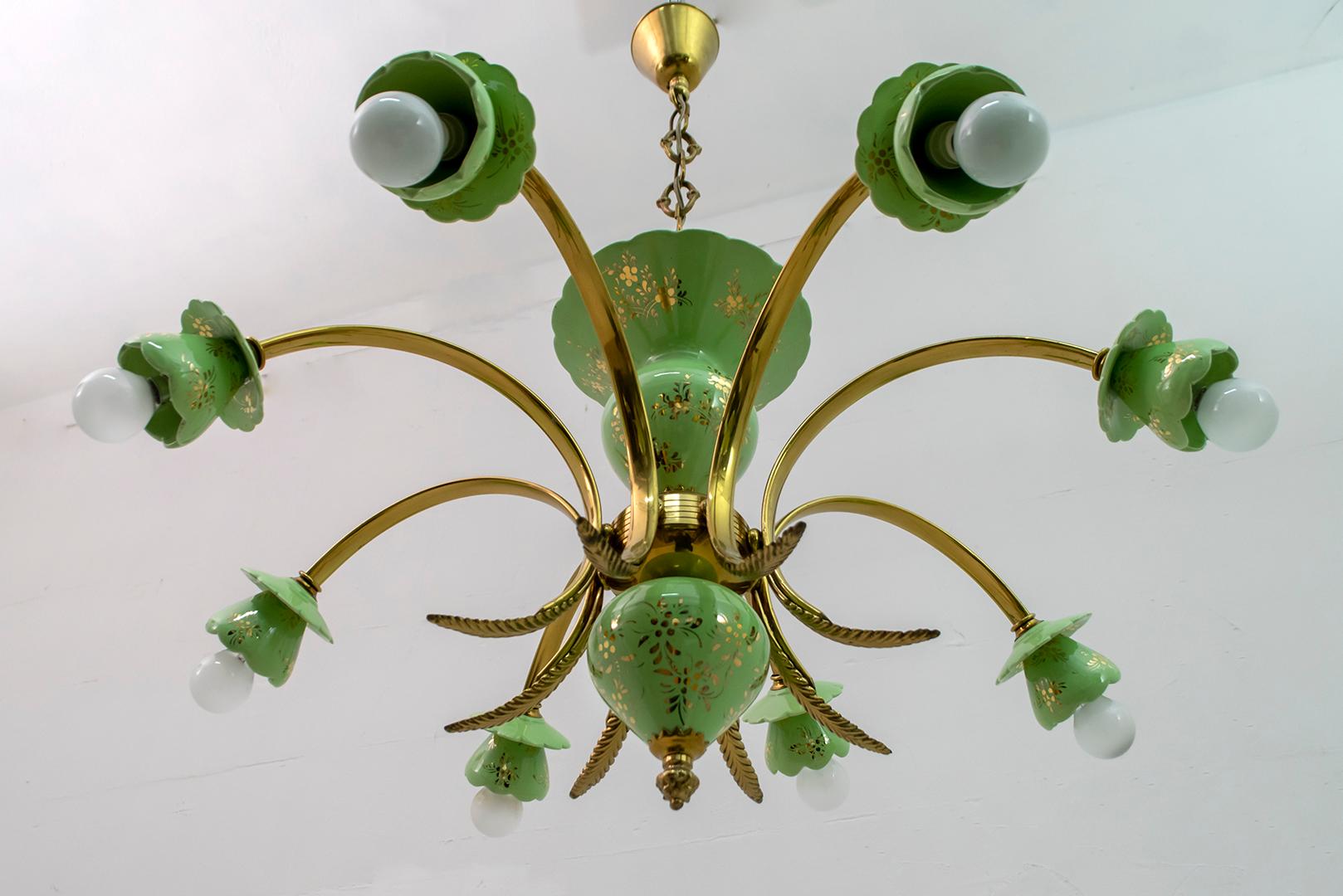 Elegant neoclassical style chandelier, eight lights, in porcelain decorated in pure gold and gold plated brass. Italian production from the 1960s.