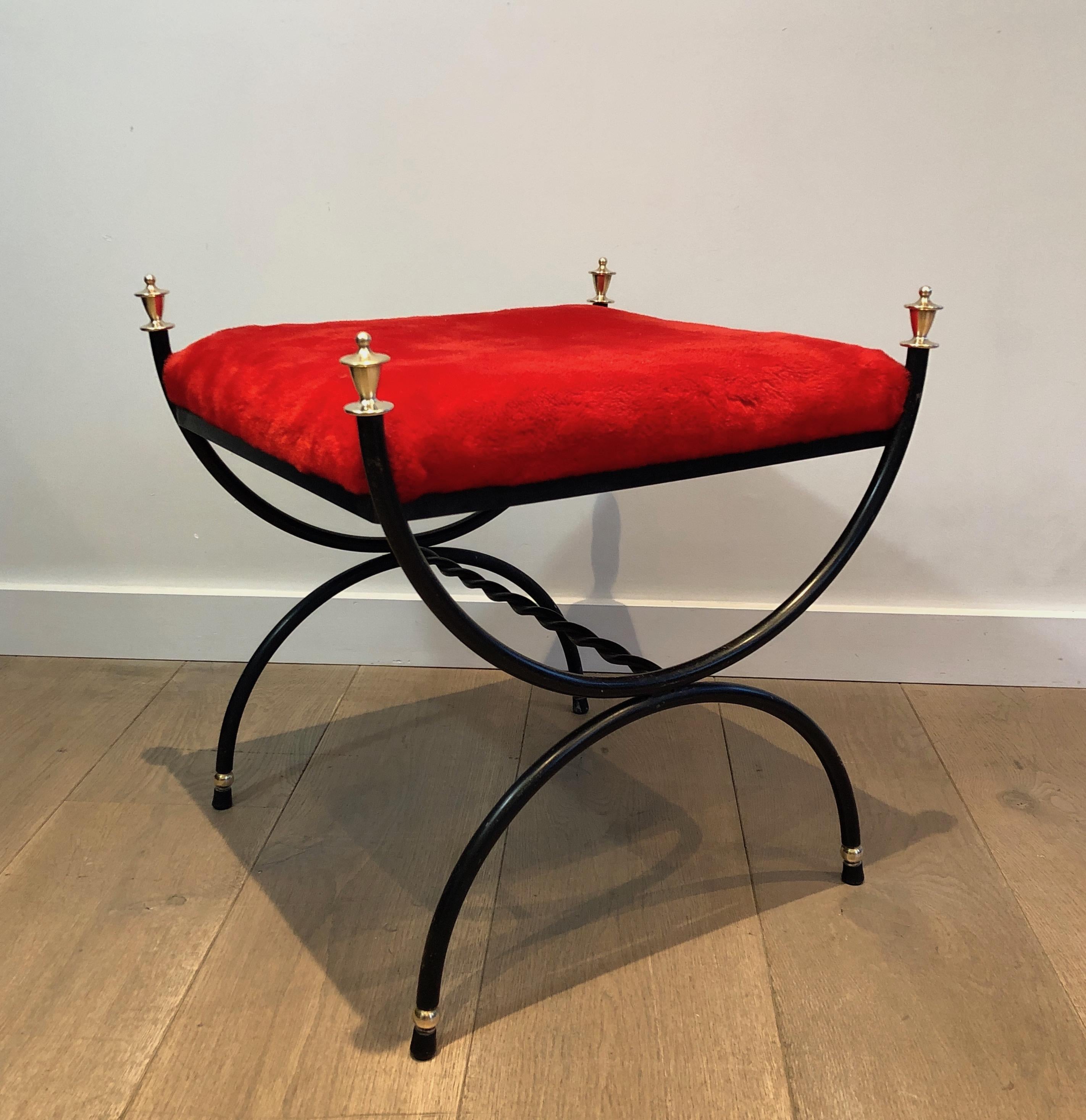 This neoclassical style stool is made of black lacquered metal l with red velvet seat. This is a French Work. Circa 1940.
   