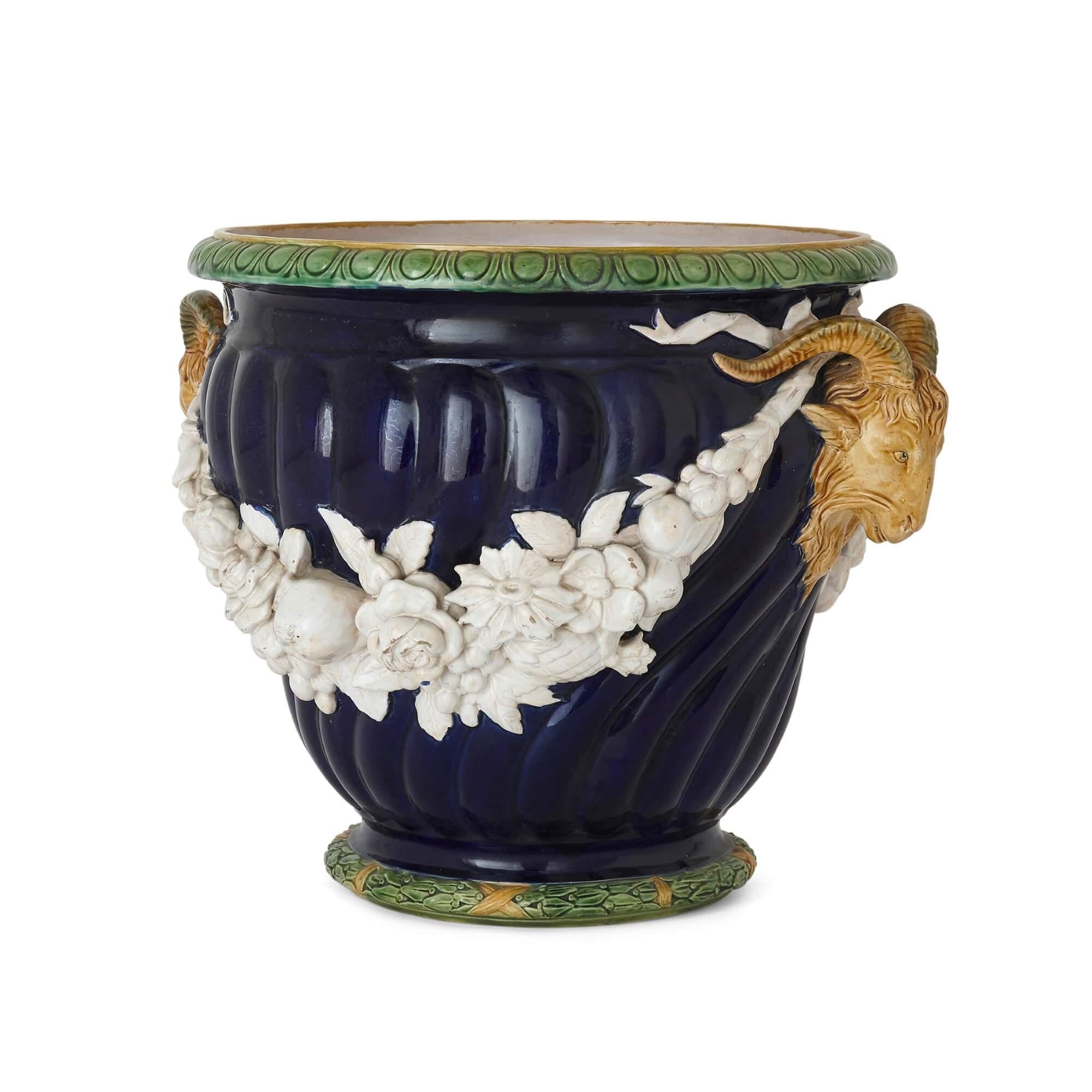 Neoclassical style blue Majolica planter by Minton
English, c. 1852
Measures: height 37.5cm, width 49cm, depth 42cm

This superb planter is crafted in the Victorian manner from brightly coloured majolica. The planter features a spirally fluted