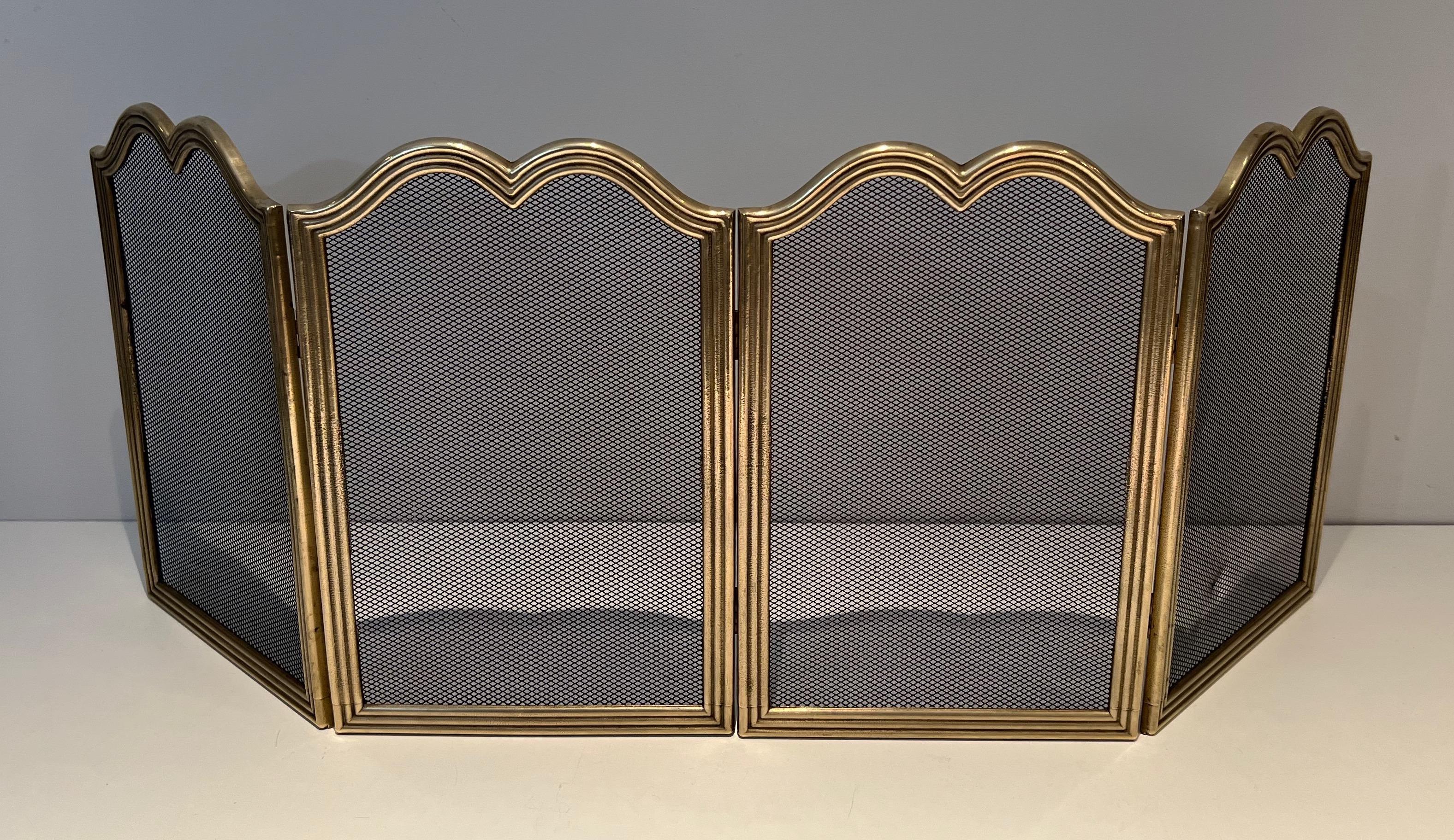This rare neoclassical style 4 panels fireplace screen is made of brass and grilling . This is a French work. Circa 1970