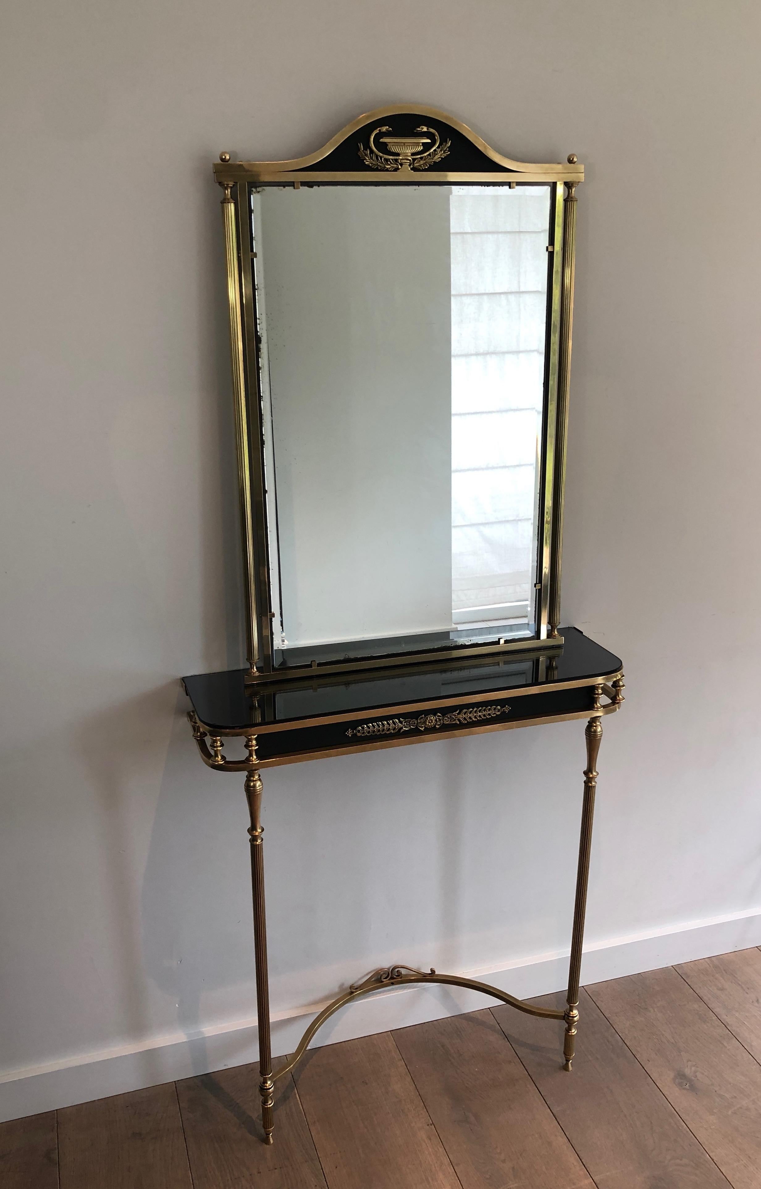 This Empire style console and mirror are made of brass and lacquered metal with decorated mirror. 
This is a French work, circa 1940.
Console and mirror can be sold separately.