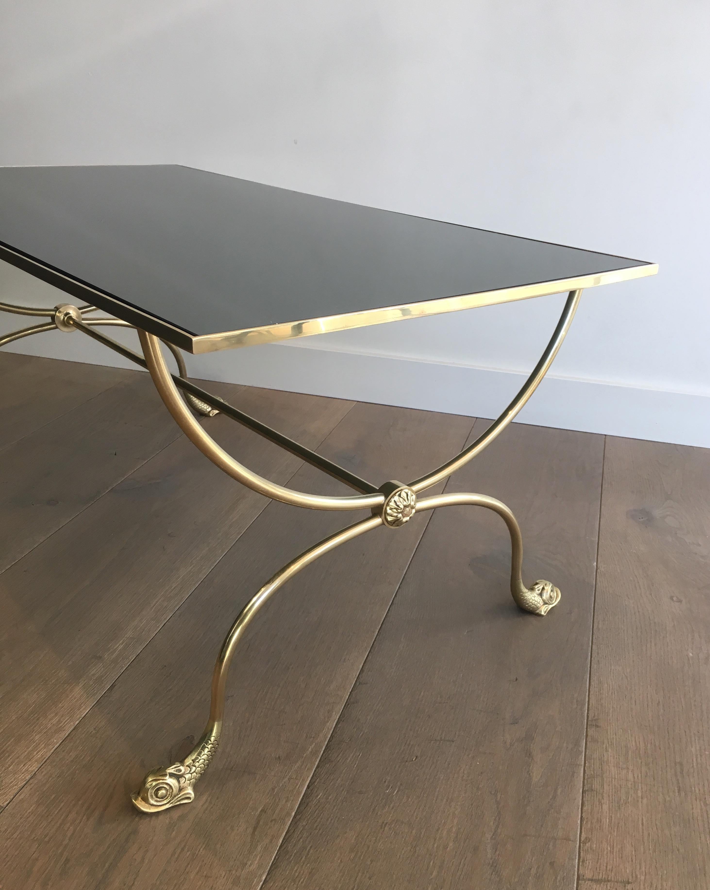 Mid-20th Century Neoclassical Style Brass Coffee Table with Dolphins Heads and Mirror Top For Sale