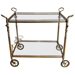 Neoclassical style brass drinks trolley with cherubs