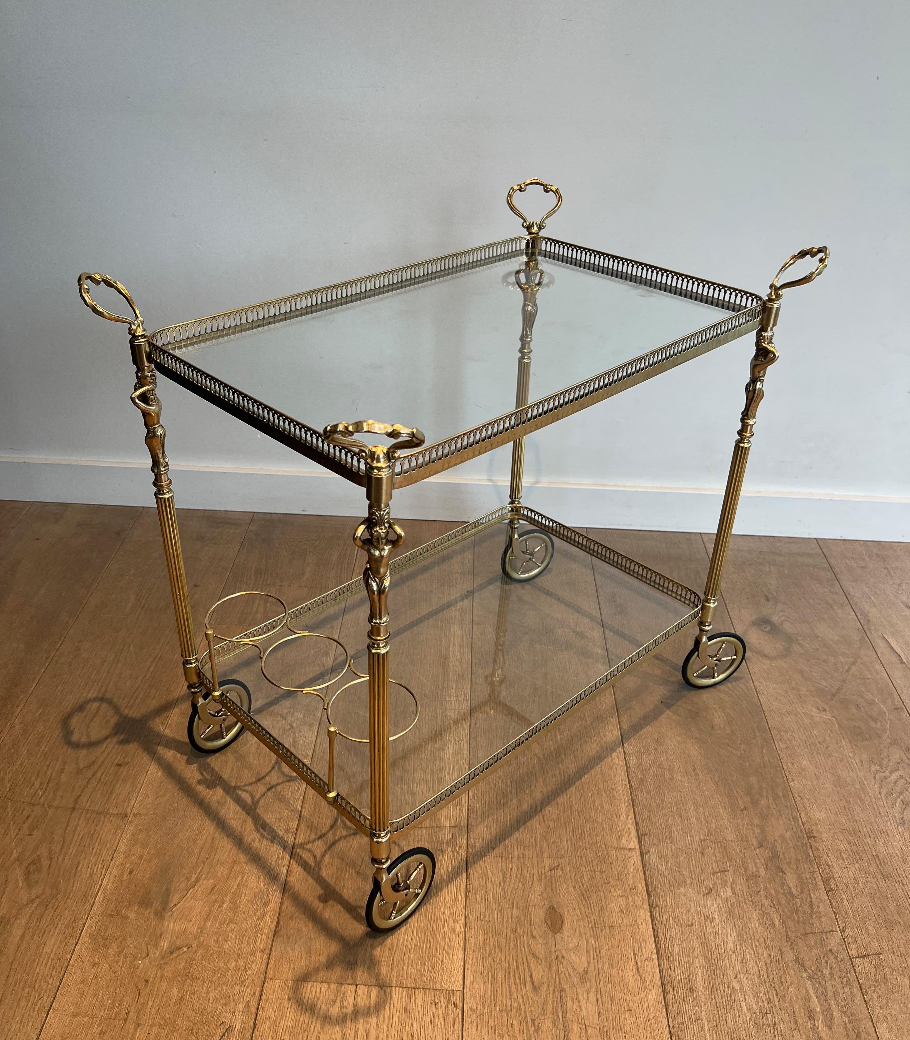 This very nice, elegant and rare neoclassical style drinks trolley is made of brass with cherubs. This is a French work in the style of Maison Jansen. Circa 1940