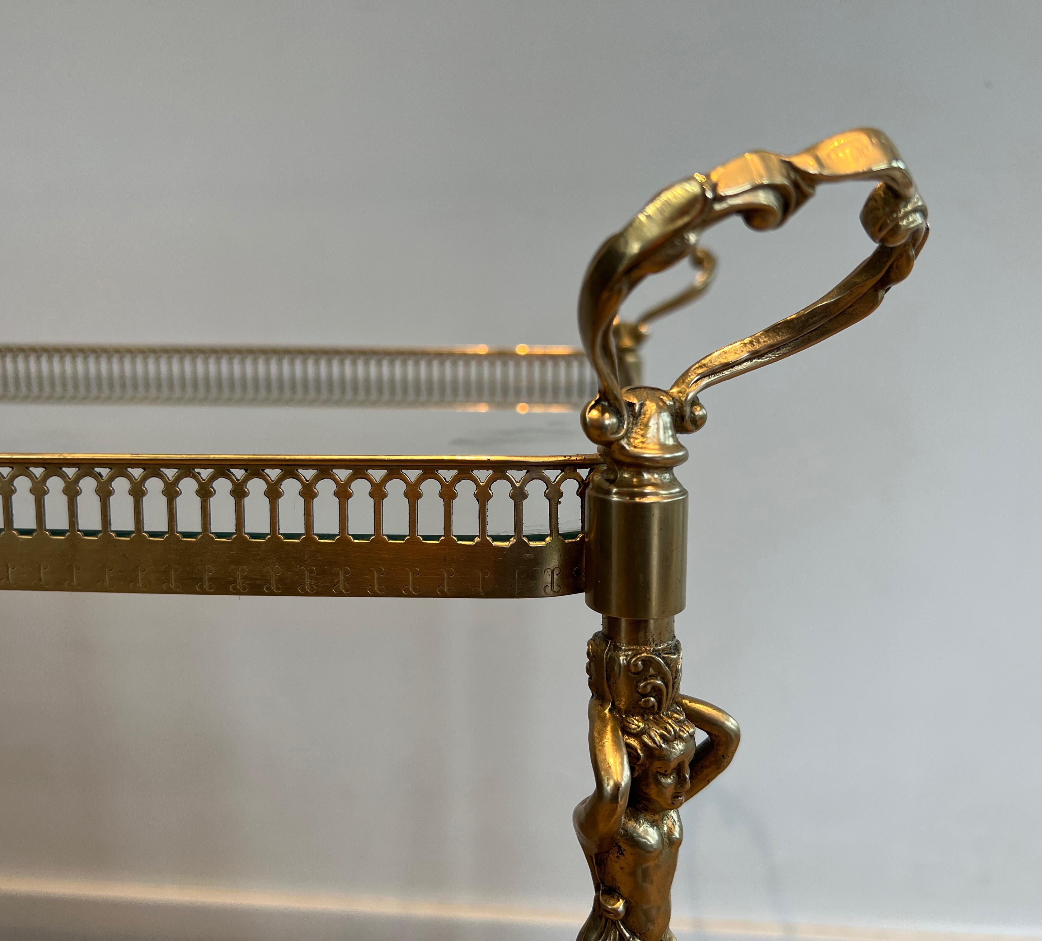 Brass Neoclassical style brass drinks trolley with cherubs For Sale