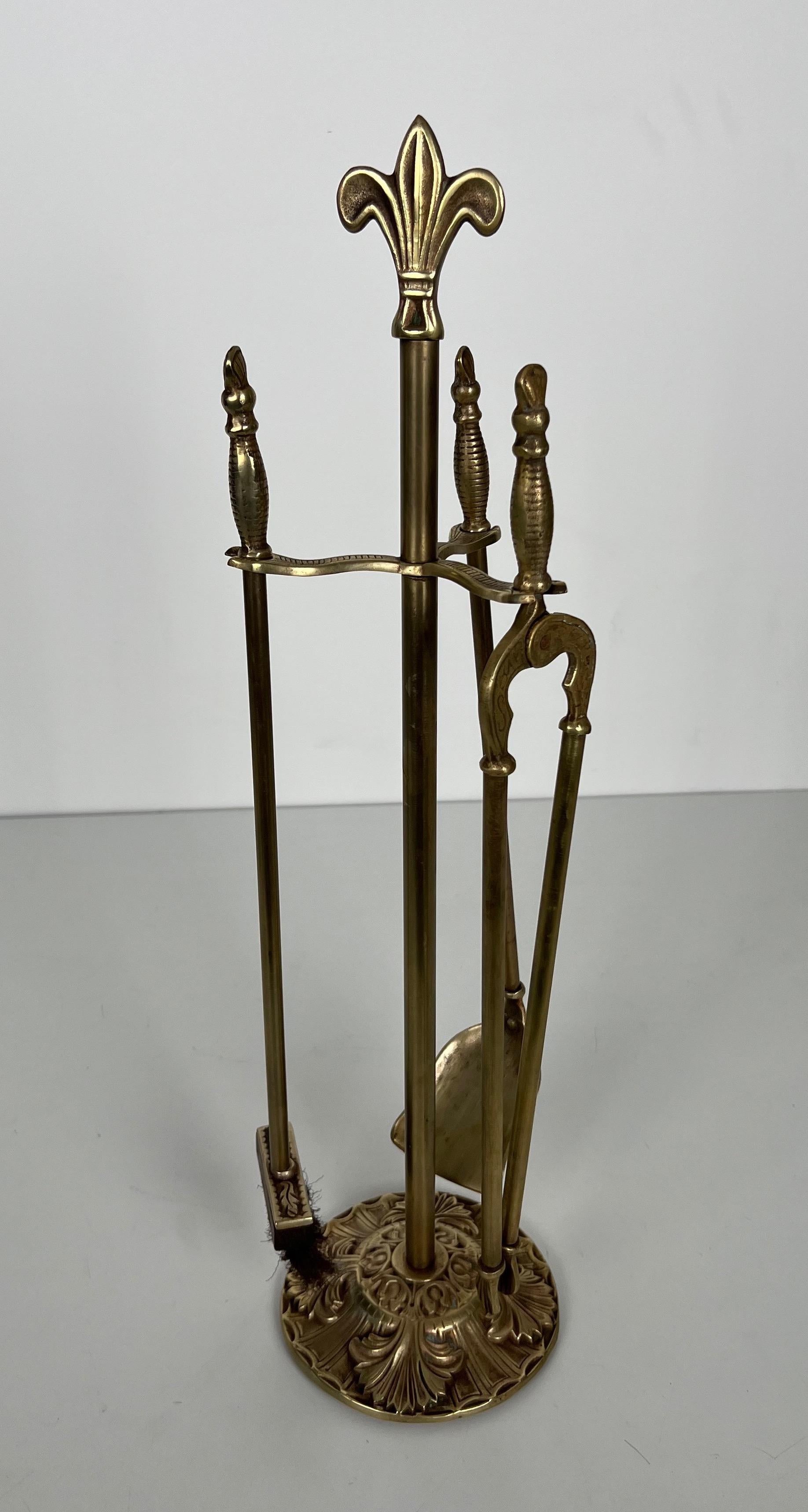 This nice and unusual neoclassical style fireplace tools is made of  brass. This set is decorated with lily flowers. This is a French work. Circa 1970