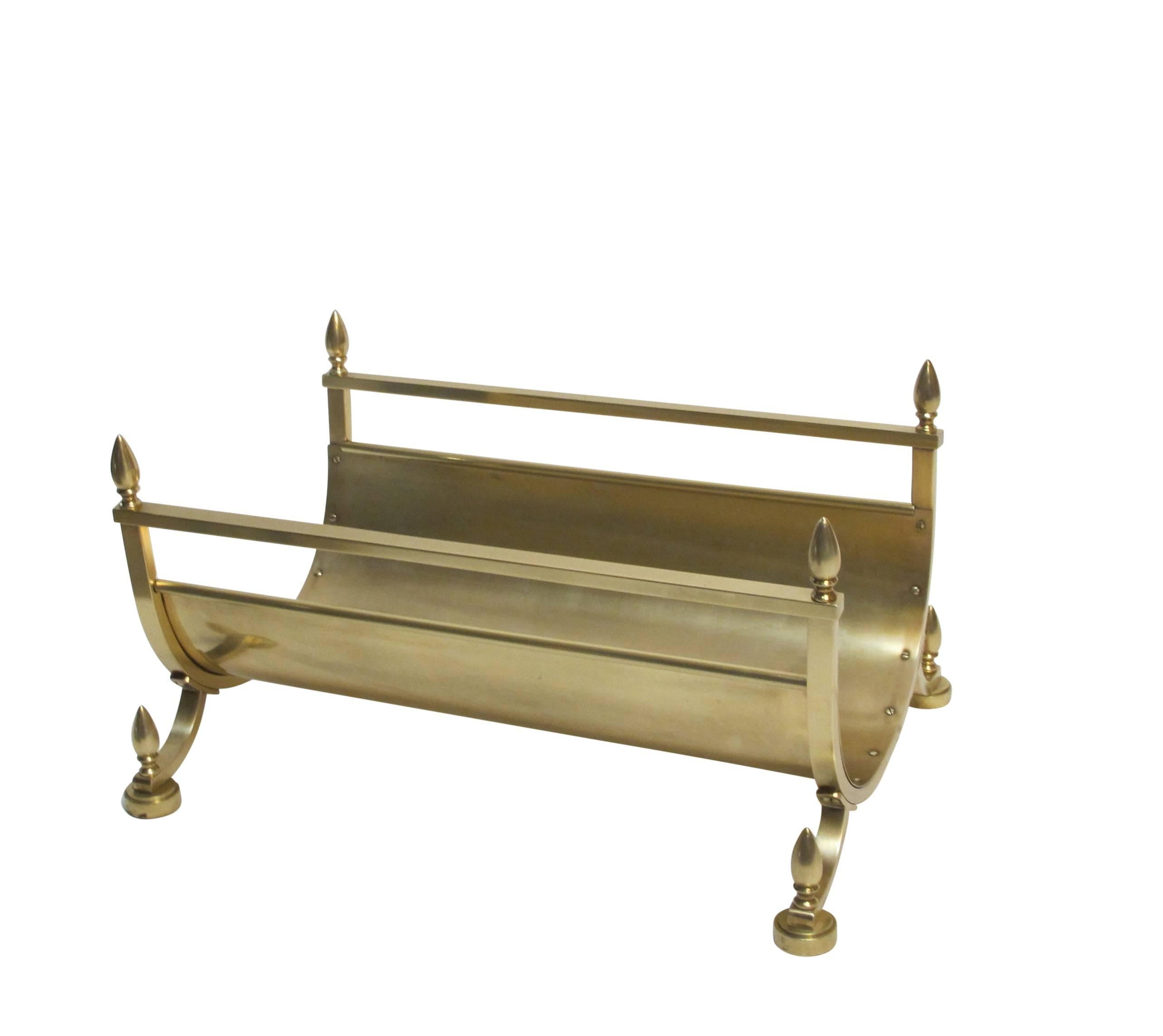 For the fireplace, a brass log holder (can be used for magazines as well) in the neoclassical style with urn shape finials, American, mid-20th century.
Recently polished and re-lacquered.