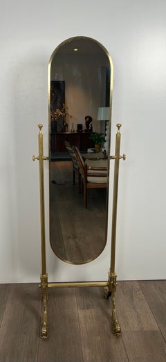 Neoclassical Style Brass Psyche Mirror with Dolphins Base. by Maison Jansen