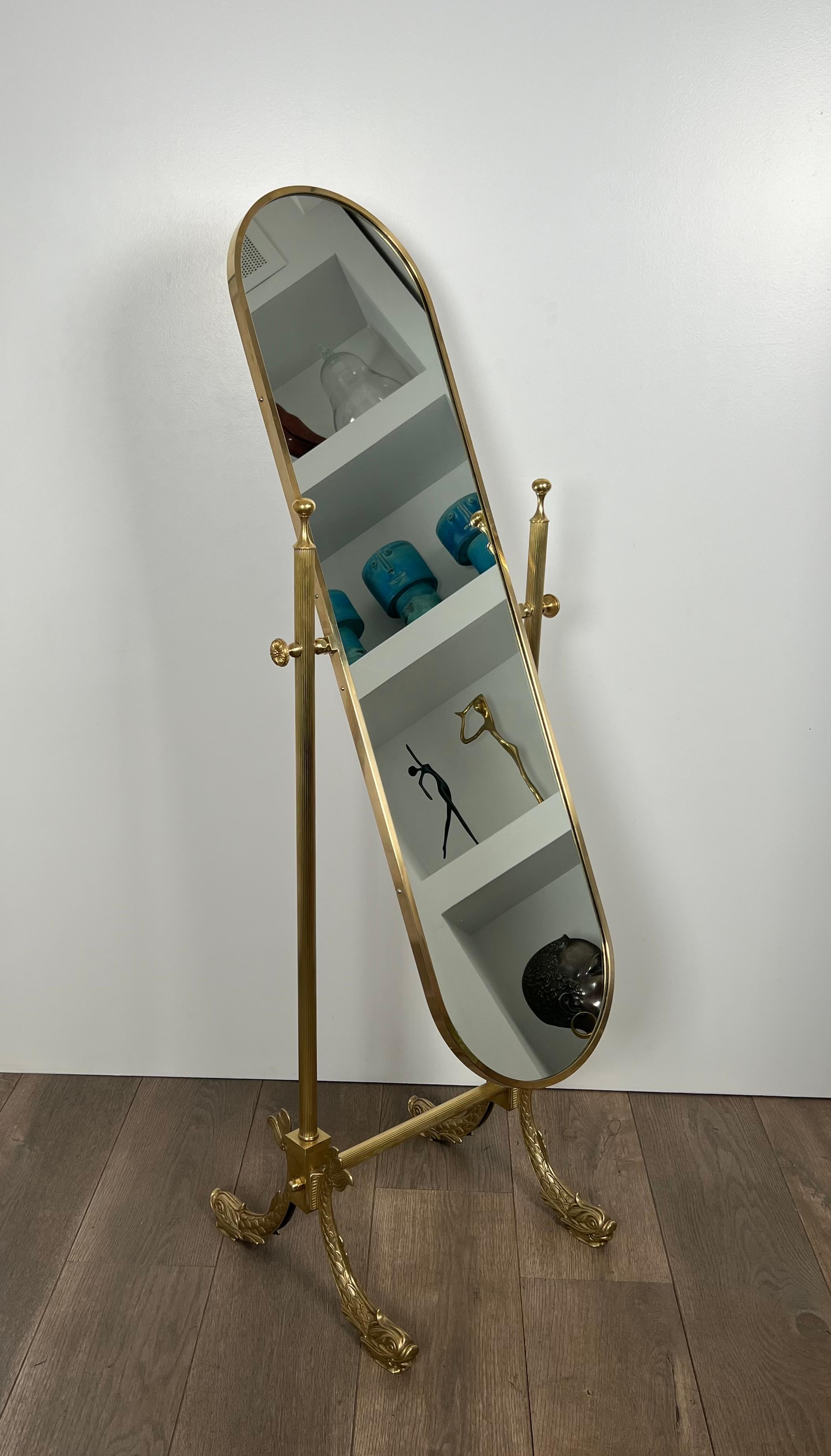 French Neoclassical Style Brass Psyche Mirror with Dolphins Base. by Maison Jansen