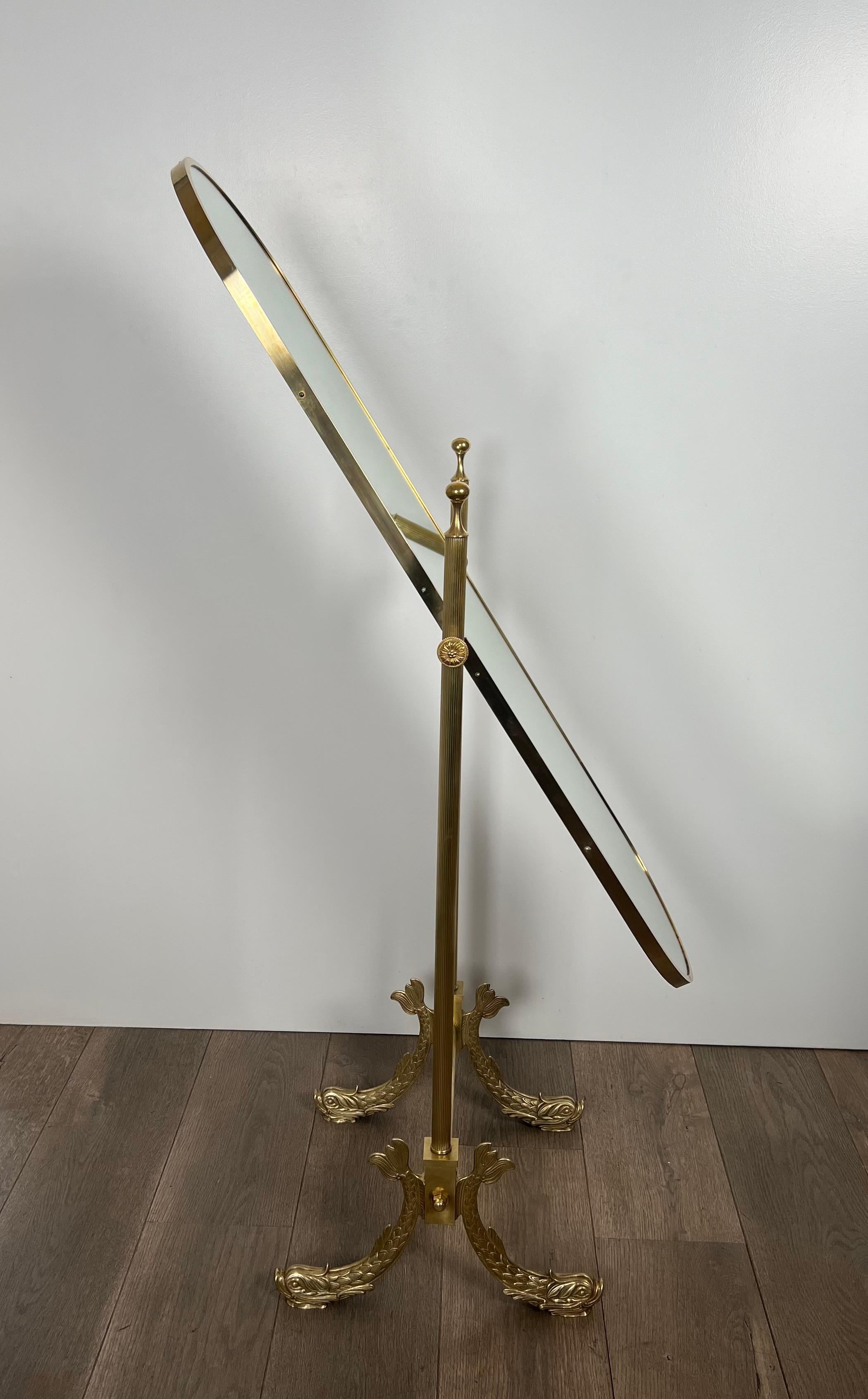 Mid-20th Century Neoclassical Style Brass Psyche Mirror with Dolphins Base. by Maison Jansen