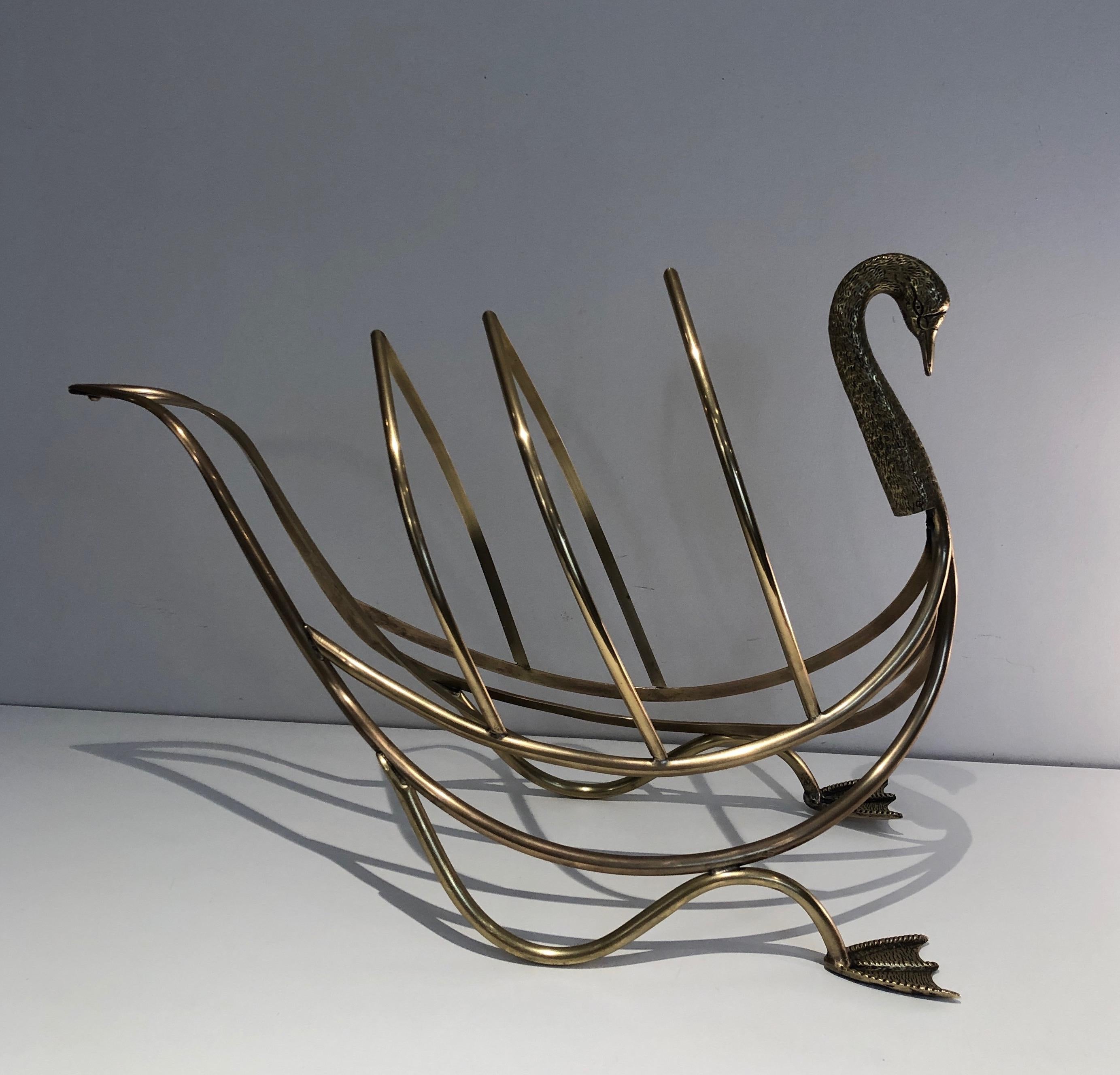 This neoclassical style swan magazine rack is all made of brass. This piece is signed Italy and so was made in Italy for famous French designer Maison Jansen. Circa 1940.