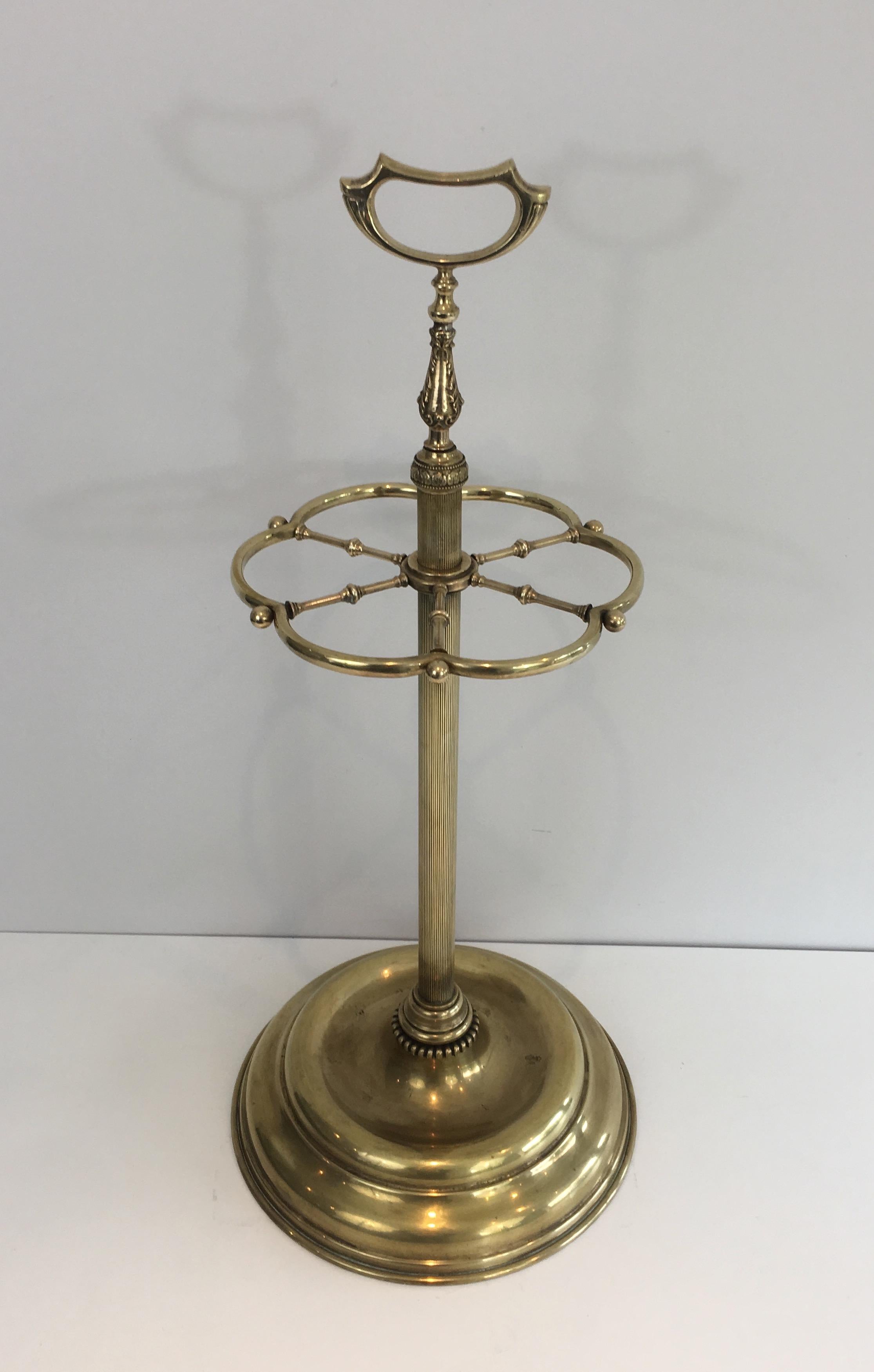 This beautiful neoclassical style umbrella stand is all made of brass. This is a French work, circa 1940.