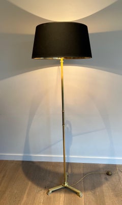 Lampadaire de style néoclassique en bronze et laiton avec pieds à griffes par Guy Lefevre