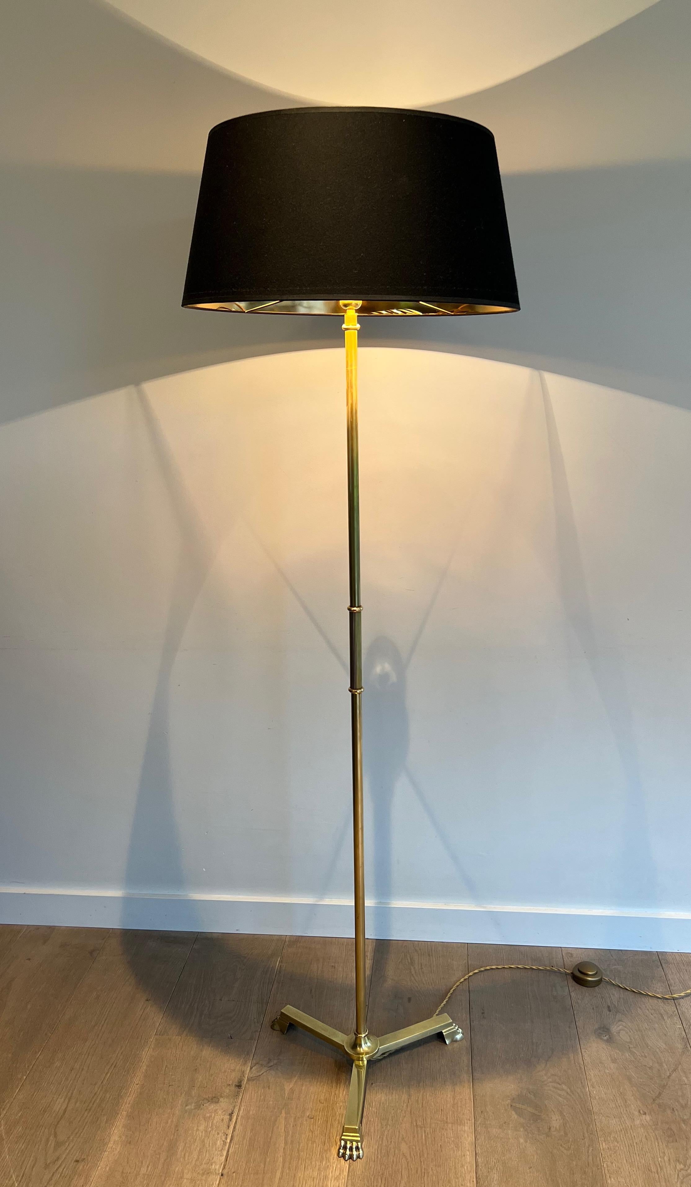 French Neoclassical Style Bronze and Brass Floor lamp with claw feet by Guy Lefevre  For Sale