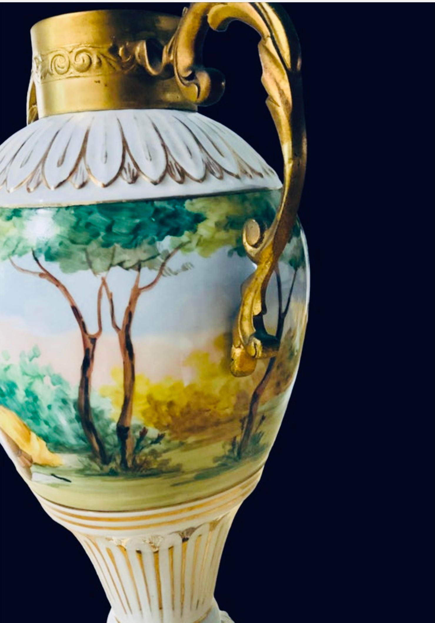 This is a heavy mounted gilt bronze porcelain urn. It is hand painted in the center of the body with a pastoral scene of a romantic couple seated and the gentleman is offering a bouquet of flowers to the lady. The other side depicts a scene of a