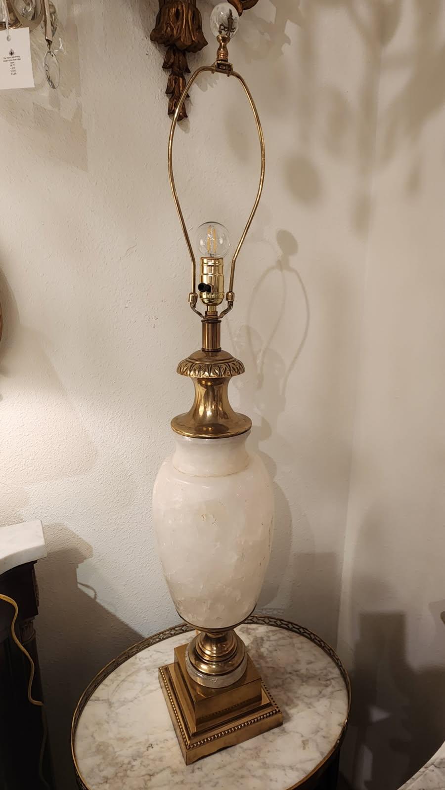This listing is for a set of 2 rock crystal Neoclassical style table lamps. The base of these lamps are bronze and rock crystal vase forms with subtle gray veining. With original harp and clear glass round finial. 