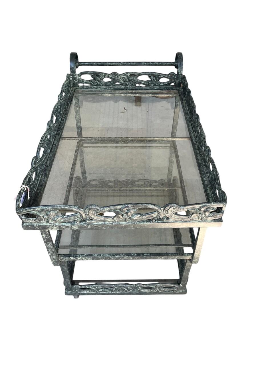 Elevate your outdoor entertaining with the Neoclassical Style Brown Jordan Three Tier Aluminum Bar Cart. Crafted with precision and elegance, this serving trolley embodies timeless sophistication. Its sturdy aluminum construction ensures durability,