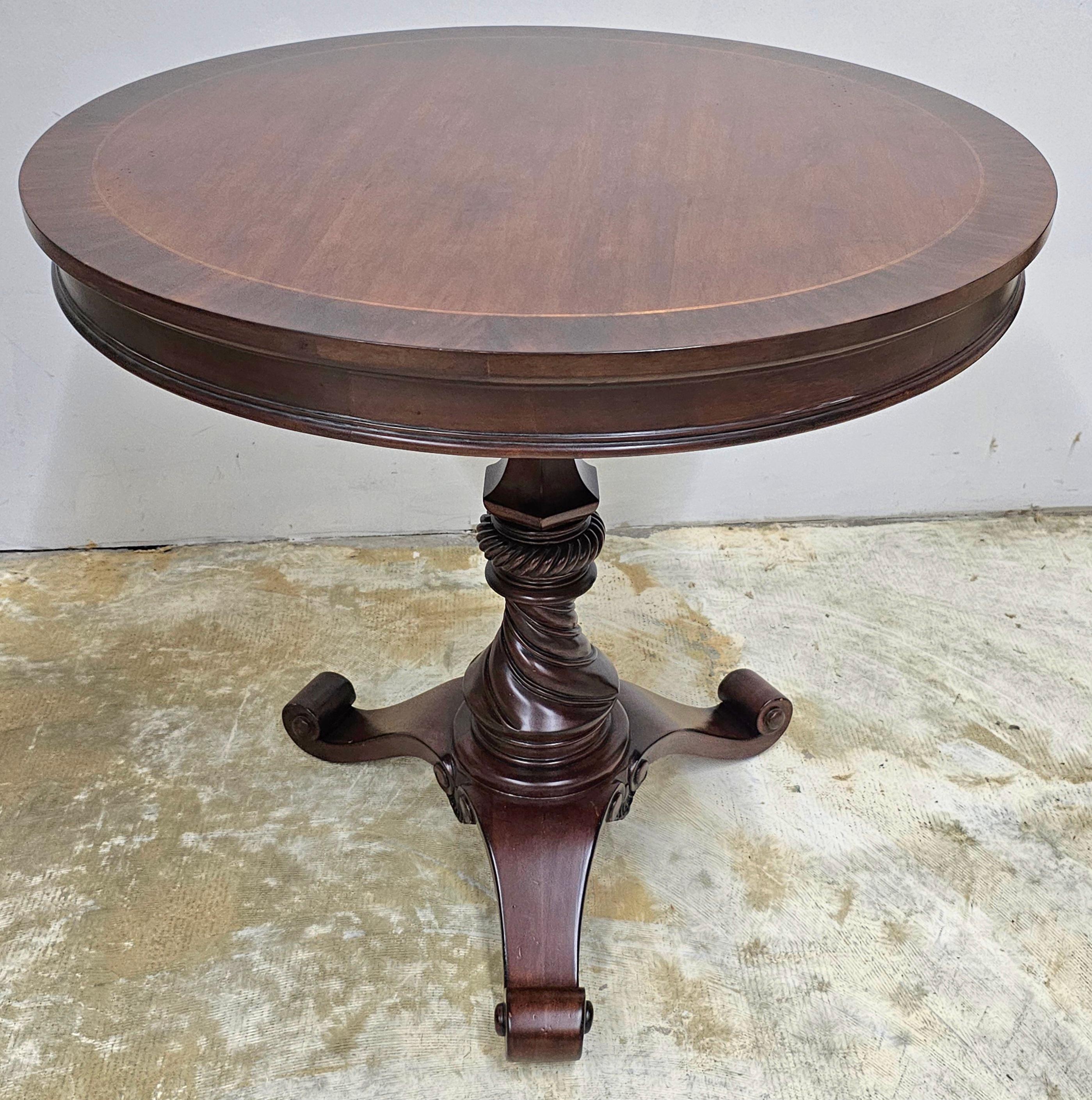 American Neoclassical Style Carved and Cross-Banded Mahogany Pedestal Center Table For Sale