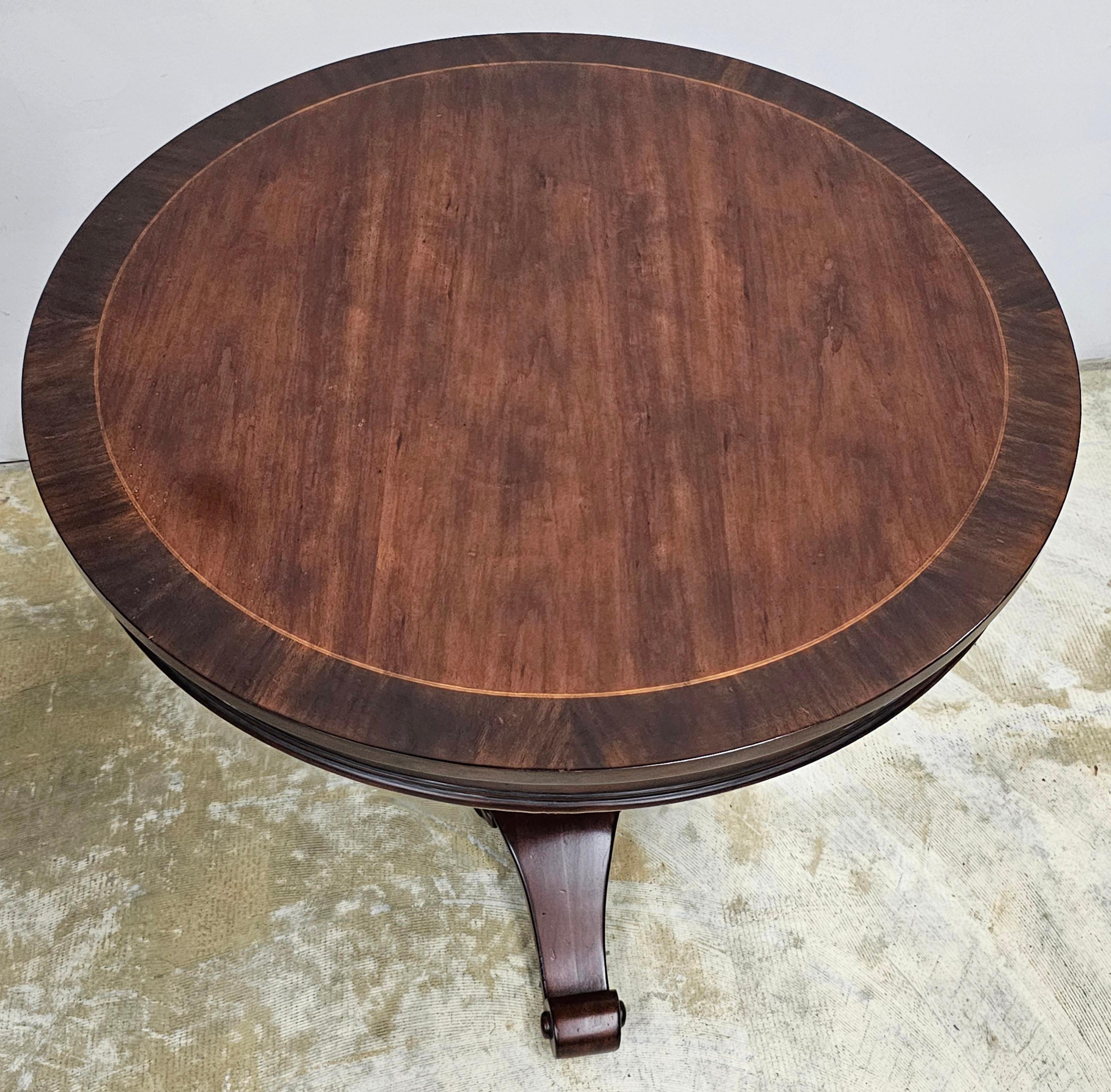 Stained Neoclassical Style Carved and Cross-Banded Mahogany Pedestal Center Table For Sale