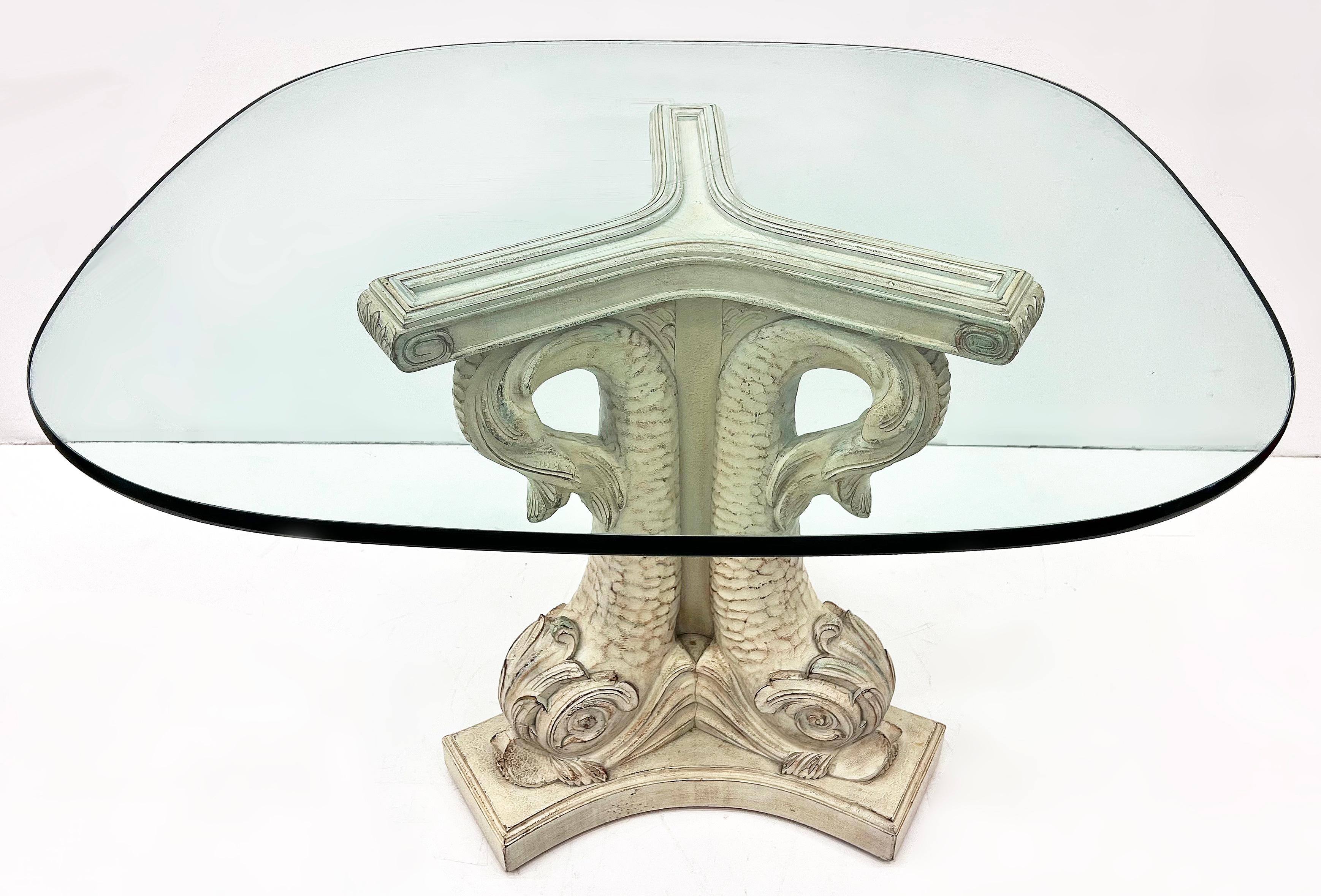 Neoclassical style carved Dolphins Venetian Gueridon table with glass top

Offered for sale is a vintage neoclassical style carved wood Venetian gueridon pedestal table with dolphins. The table is elegantly carved and was made in Spain. It is