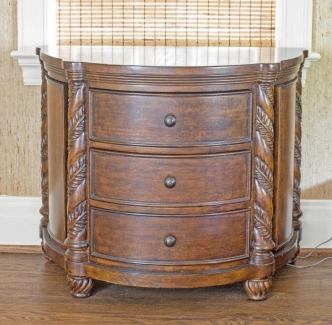 From a palm beach landmark home
neoclassical style carved walnut demilune commode
with three drawers flanked by leaf-carved stiles. Measures: Height 29¾ in., width 36 in., depth 20¼ in.
 