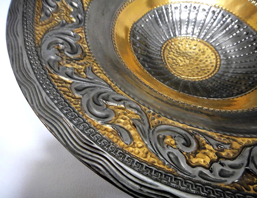 Marioni Neoclassical Style Ceramic Centerpiece, Italy

Offered for sale is a striking glazed ceramic centerpiece created in the neoclassical style by Marioni of Italy. The bowl is created to appear as though it is metal.