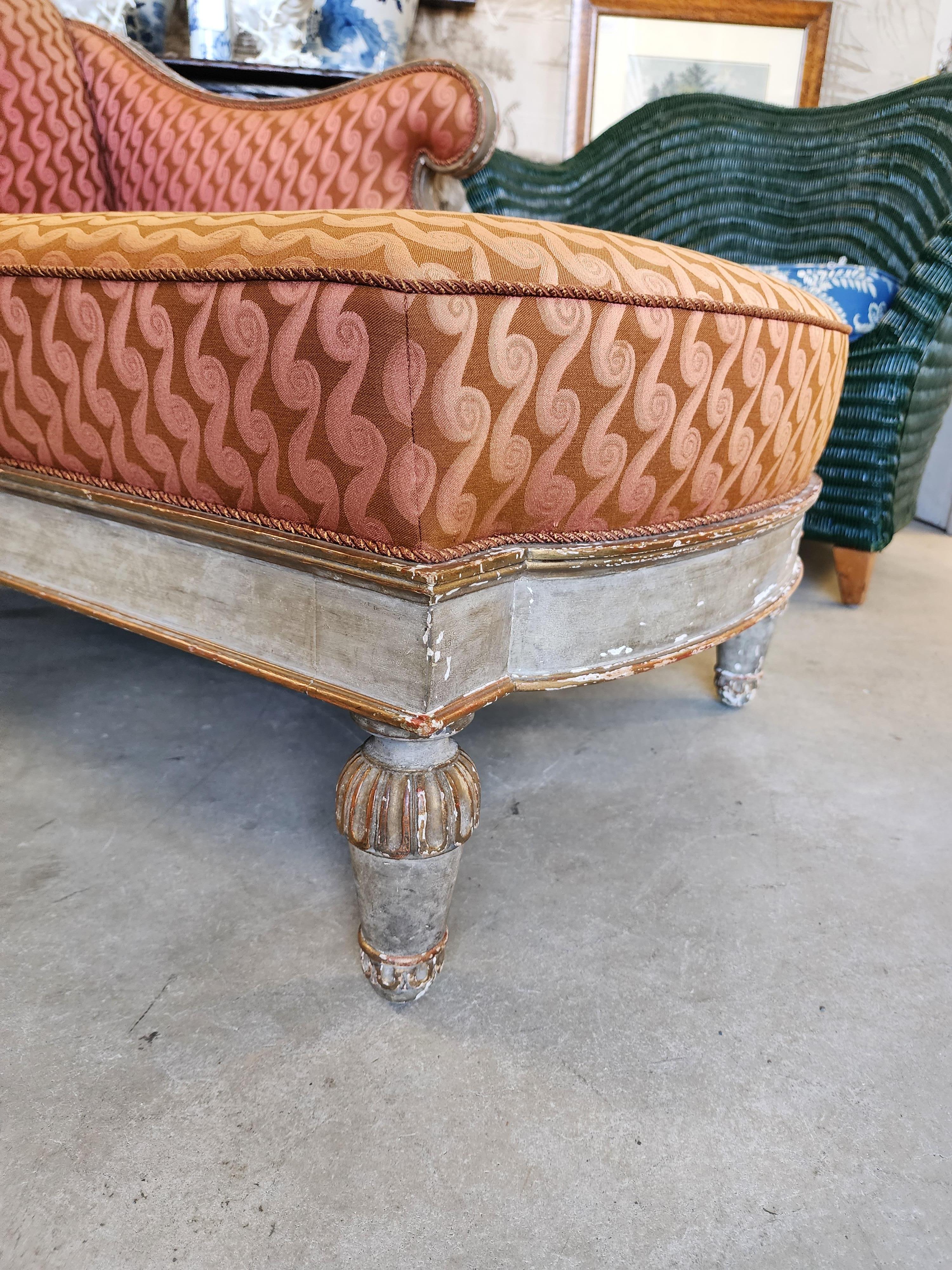 Diminutive reconnaier and the neoclassical style period produced in the 19th century this carved gilded and painted beauty has the most lovely proportions. 
The surface is carved and done quite well. This could add elegance and Beauty to any room.