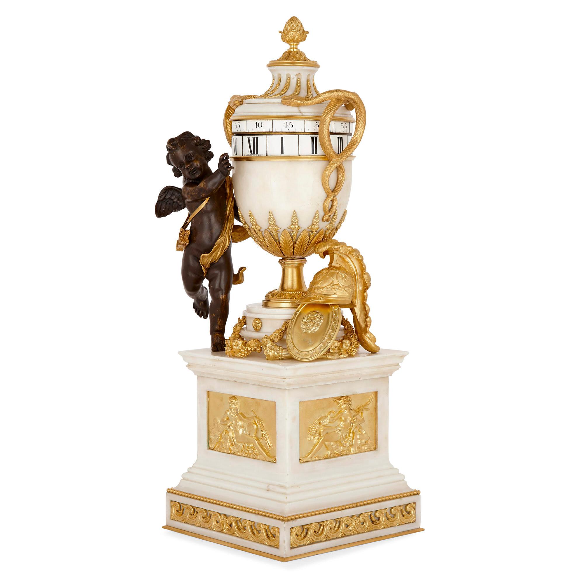 Neoclassical style circular movement mantel clock by Leroy & Cie
French, circa 1880
Measures: Height 72cm, width 25cm, depth 25cm

This superb mantel clock, crafted from white marble, gilt bronze, and patinated bronze—takes the shape of an