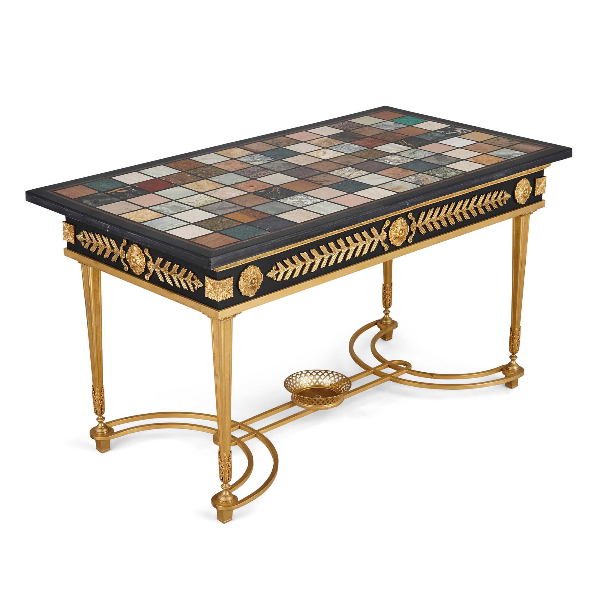 Neoclassical style coffee table with Italian marble specimen top
French, 20th century
Dimensions: Height 56cm, width 102cm, 54cm

The present coffee table is wrought in the French neoclassical style, with square tapered ormolu legs connected by