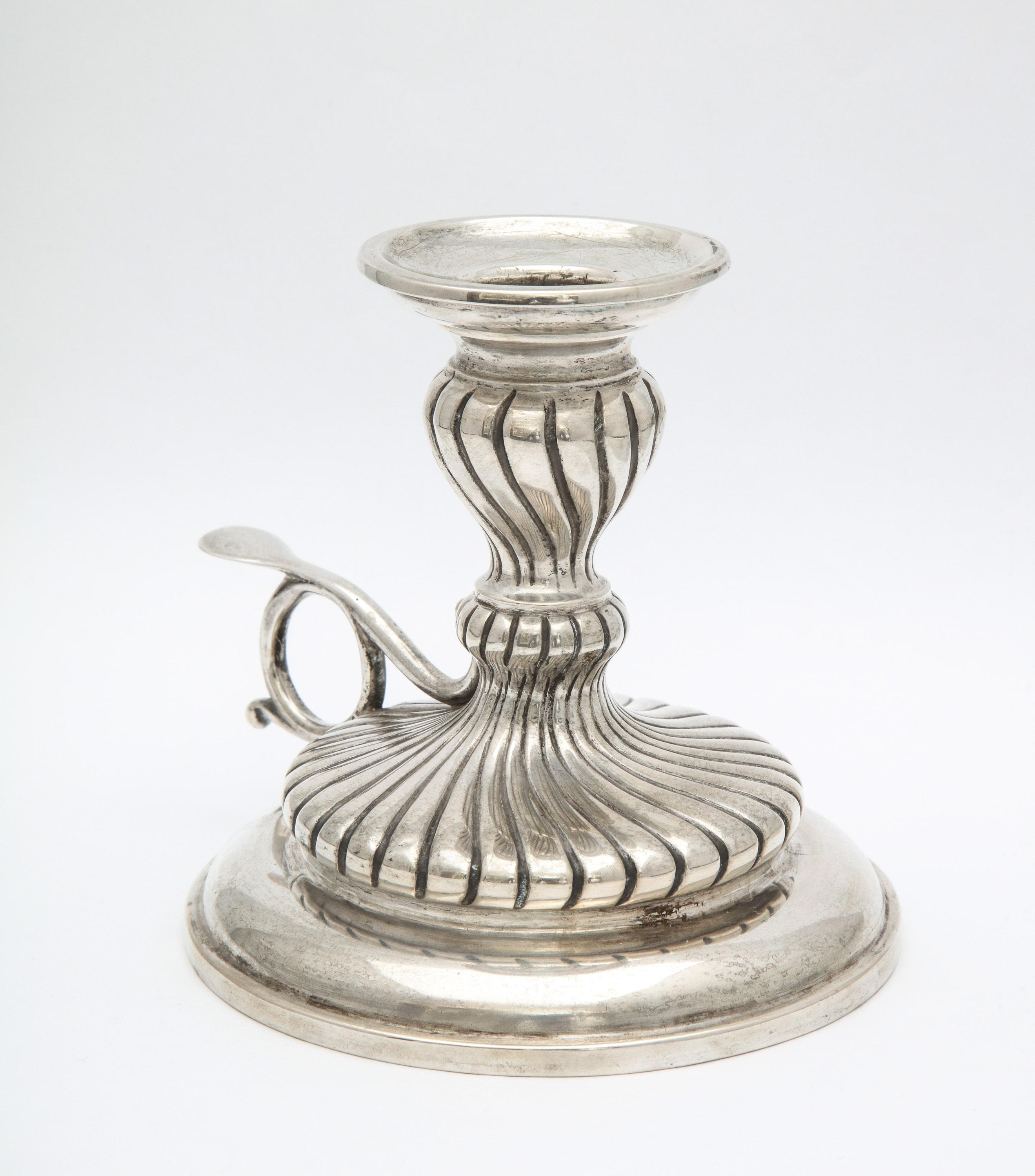Neoclassical, continental silver (.835) chamber stick, Austria, circa 1900. Measures 4 1/2 inches high x 4 1/4 inches diameter. Weighs 7.380 troy ounces. Dark spots in photos are reflections. Excellent condition.