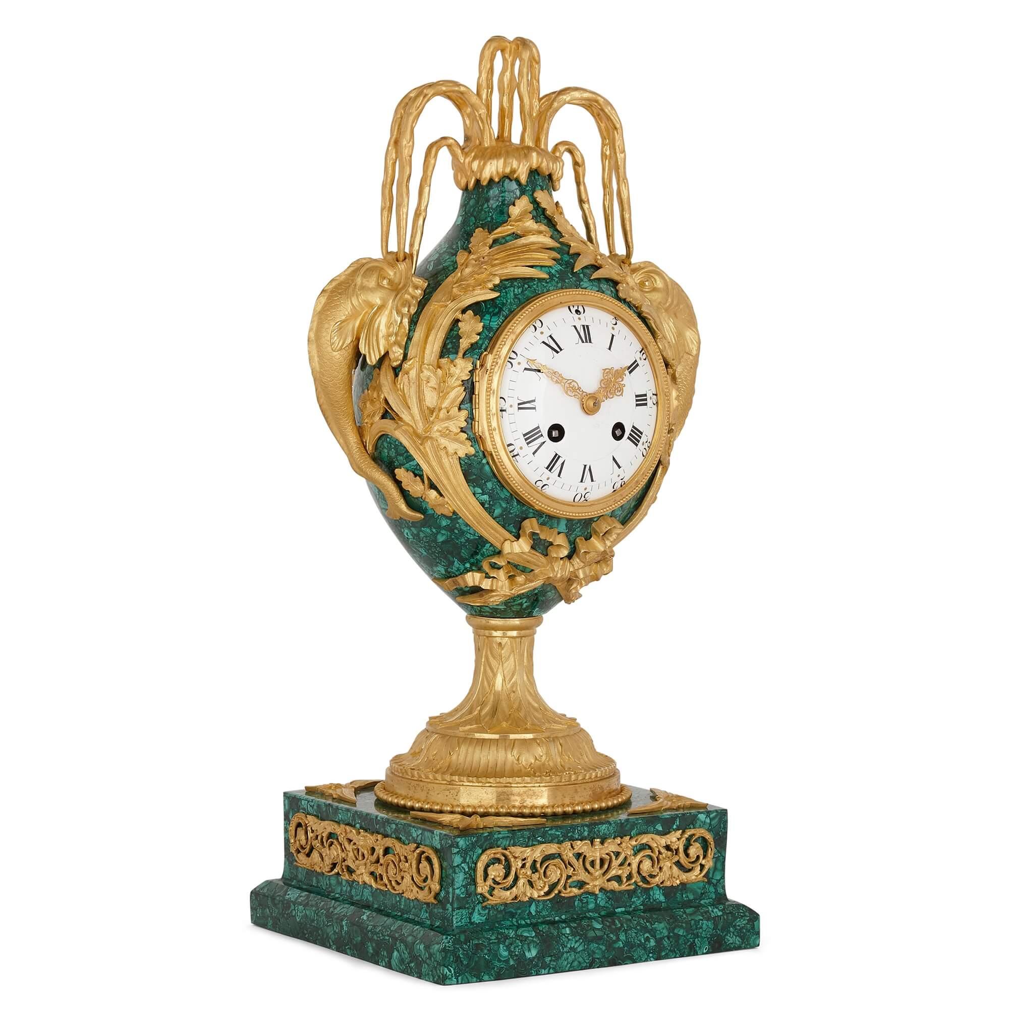 Neoclassical style gilt bronze and malachite mantel clock
French, late 19th Century
Measures: Height 47cm, width 19cm, depth 19cm

This wonderful Louis XVI style mantel clock is designed in malachite and gilt bronze—with the malachite being a