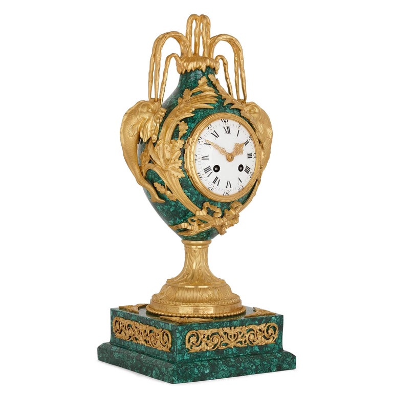 Neoclassical style gilt bronze and malachite mantel clock
French, late 19th Century
Measures: Height 47cm, width 19cm, depth 19cm

This wonderful Louis XVI style mantel clock is designed in malachite and gilt bronze—with the malachite being a