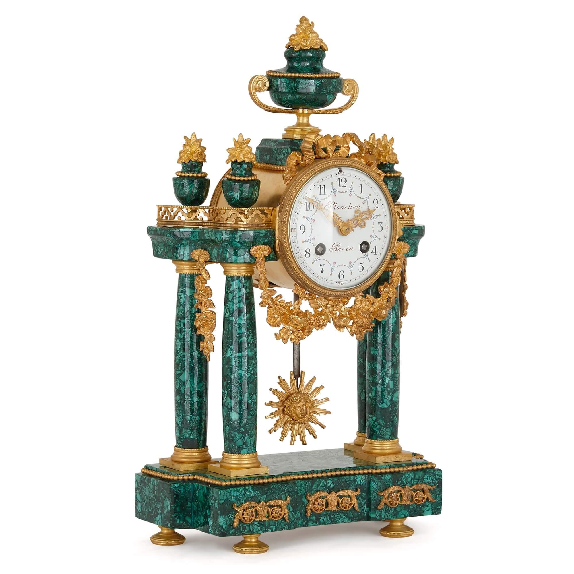 Neoclassical style gilt bronze and malachite mantel clock.
French, late 19th century
Measures: height 39cm, width 23cm, depth 11cm

This elegant mantel clock, crafted from malachite and gilt bronze, is a superb demonstration of the Louis XVI