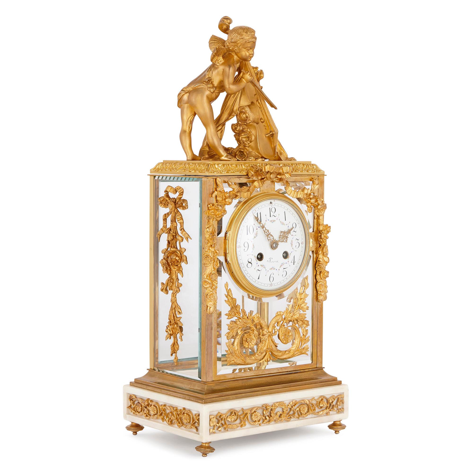 This French mantel clock is designed in an elegant Neoclassical style, after the decorative arts of the Louis XVI period (1754-1793). This clock will look beautiful placed on a mantelpiece, or in some other prominent position in a well-furnished