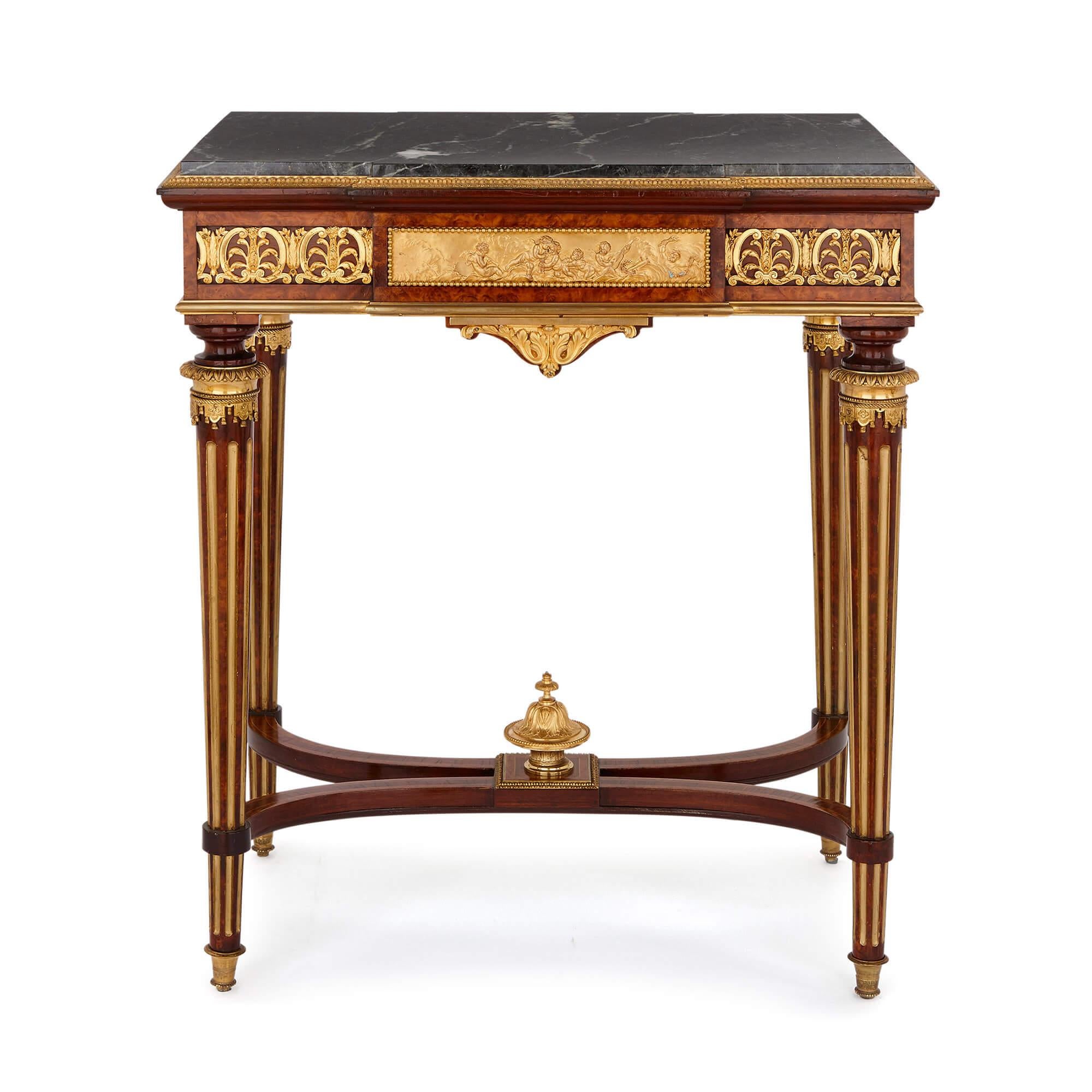 This fine and grand side table is built by one of the most esteemed makers of the 19th century, Henri Picard, and is decorated with exquisite gilt bronze mounts and topped with stylish veined green marble. The table is set on four tapered legs,