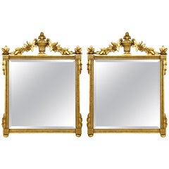 Neoclassical Style Giltwood Beveled Mirrors Decorated Urn Crest and Foliage Pair