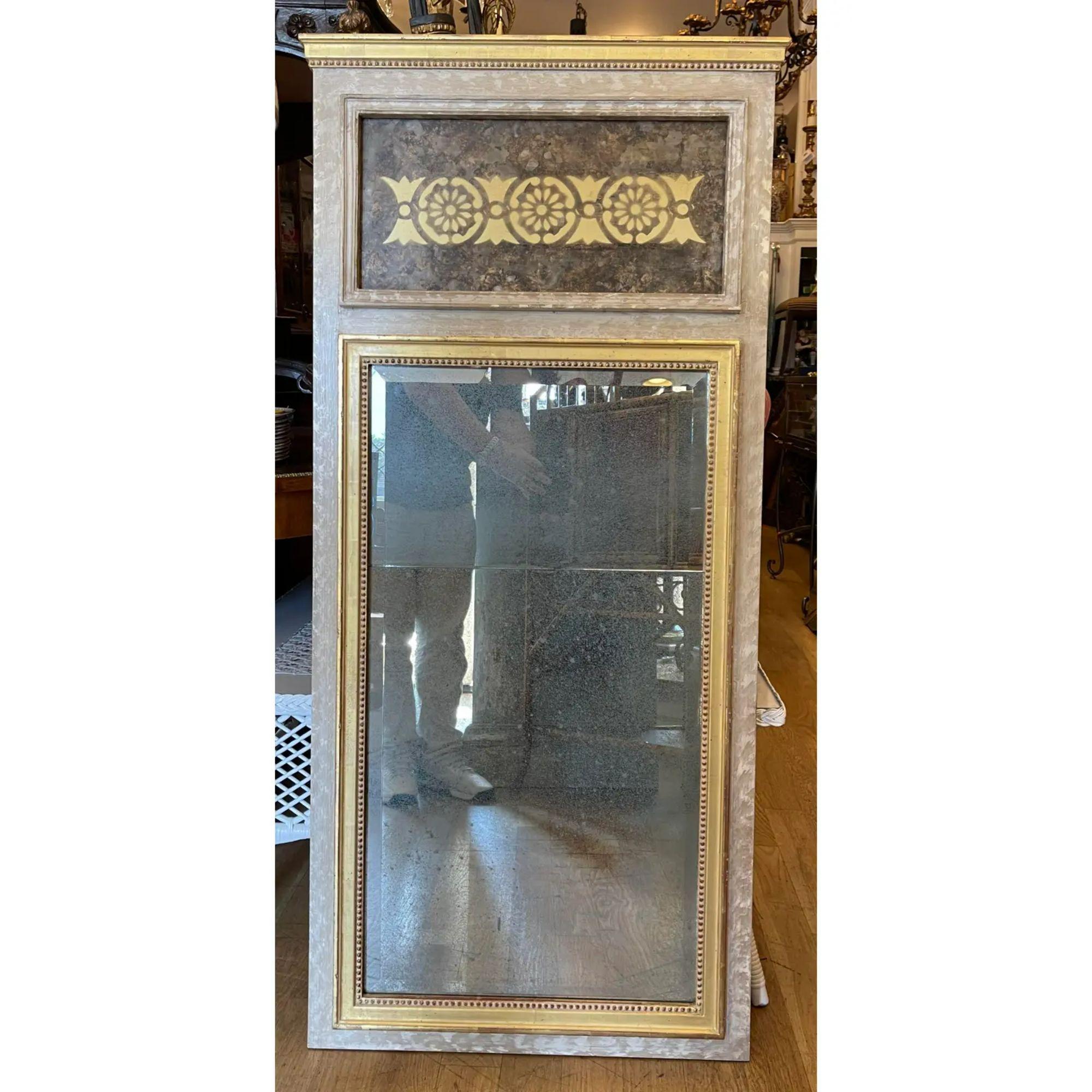 Neoclassical style giltwood Trumeau mirror. It features a modernized gilt stencil on a faux tortoise panel.

Additional information:
Materials: giltwood, mirror
Color: Gold
Period: 1990s
Styles: neoclassical
Item type: vintage, antique or